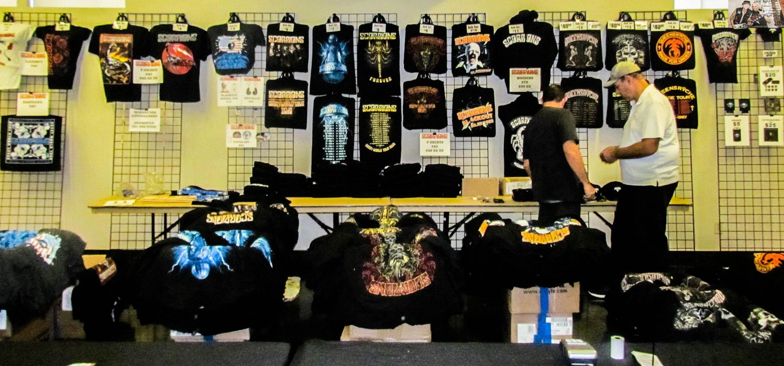The merch booth displays the shirts, hats and other products of Scorpions and Queensryche.