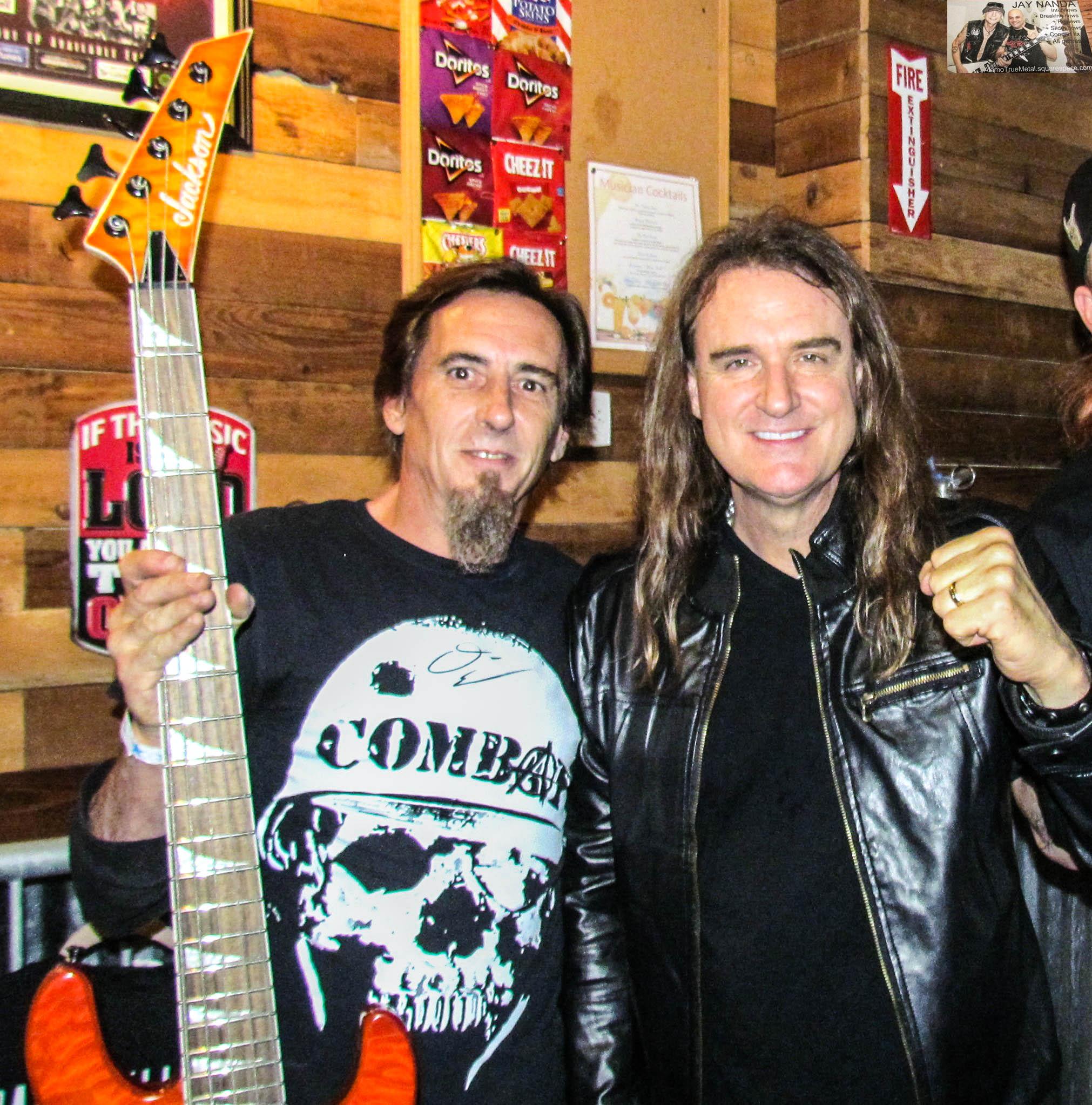 Local fan and disc jockey Brian Keith gladly accepts Ellefson’s signature orange bass.