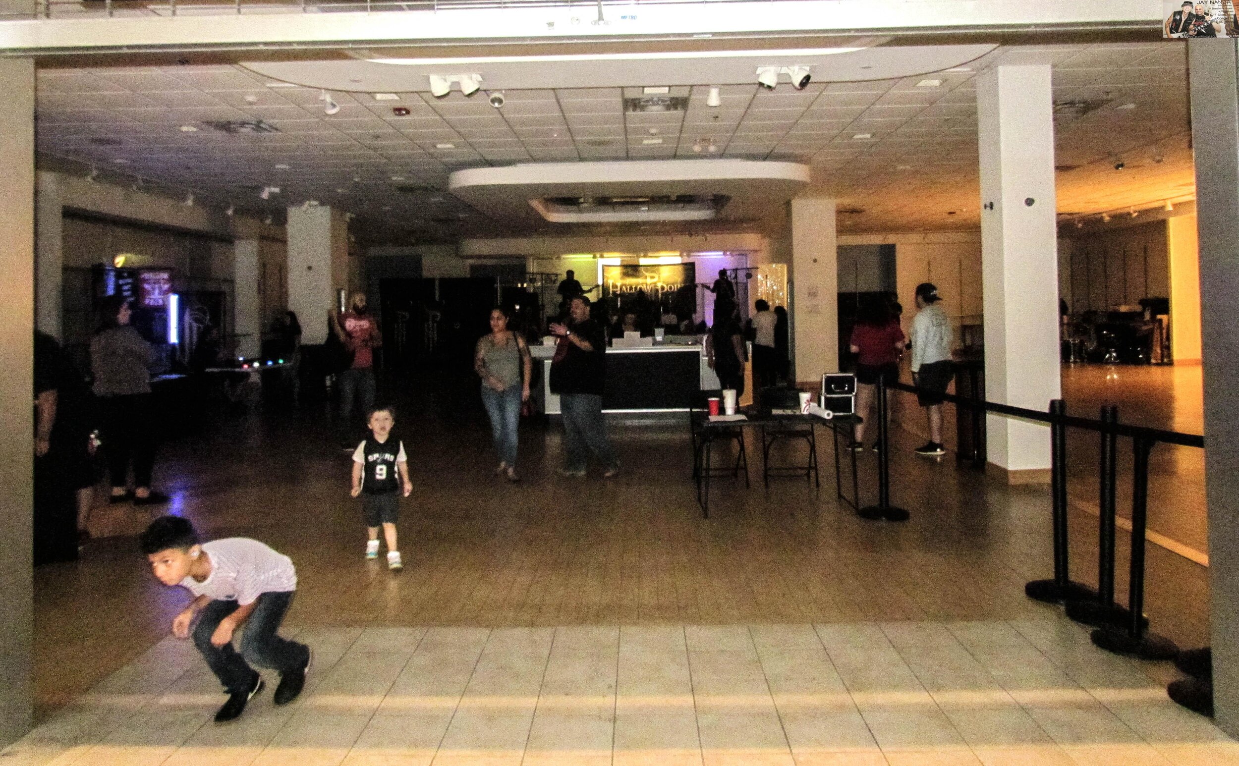 The spacious entertainment center, shown prior to the bands setting up, features the stage in the back, open bar in the center and plenty of room for bands to display merch.