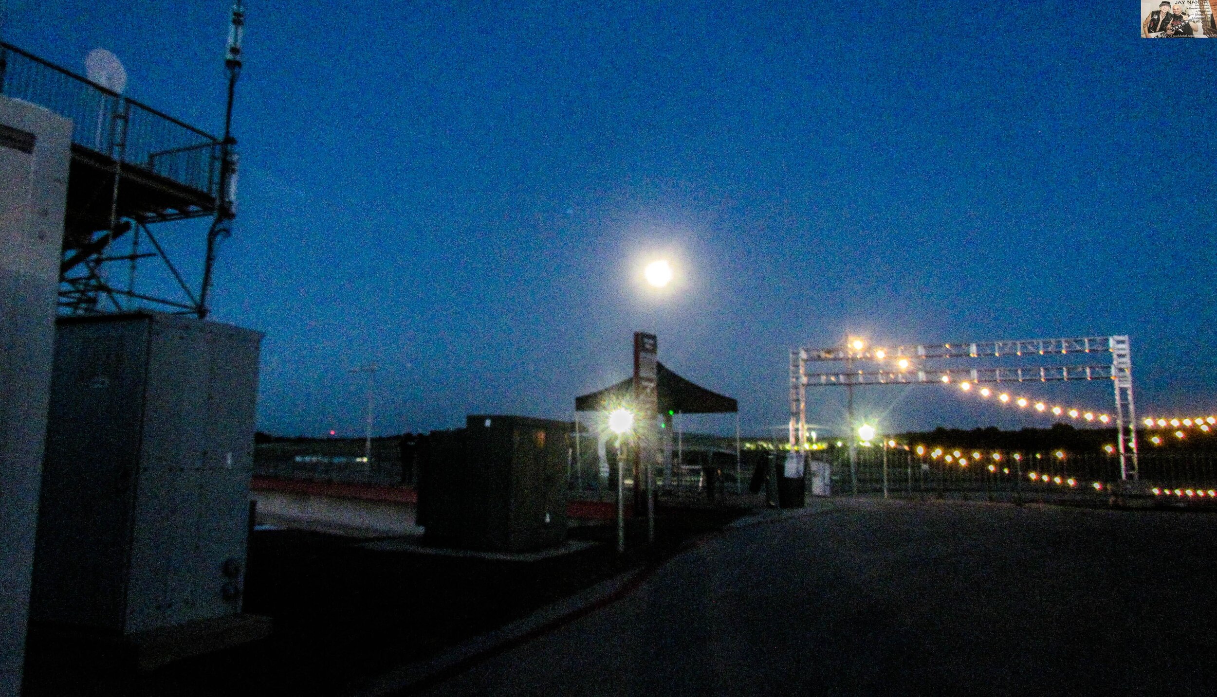  A crystal clear moonlit night permeates the sky at the Germania Insurance Amphitheater and racetrack. 