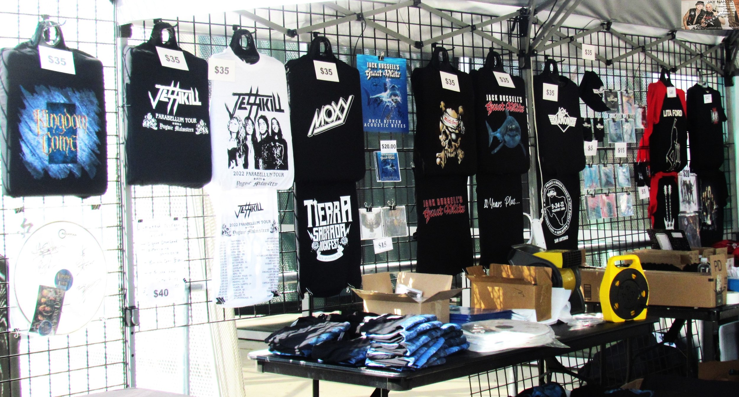  Merch is displayed outside the venue in the smoking area. 