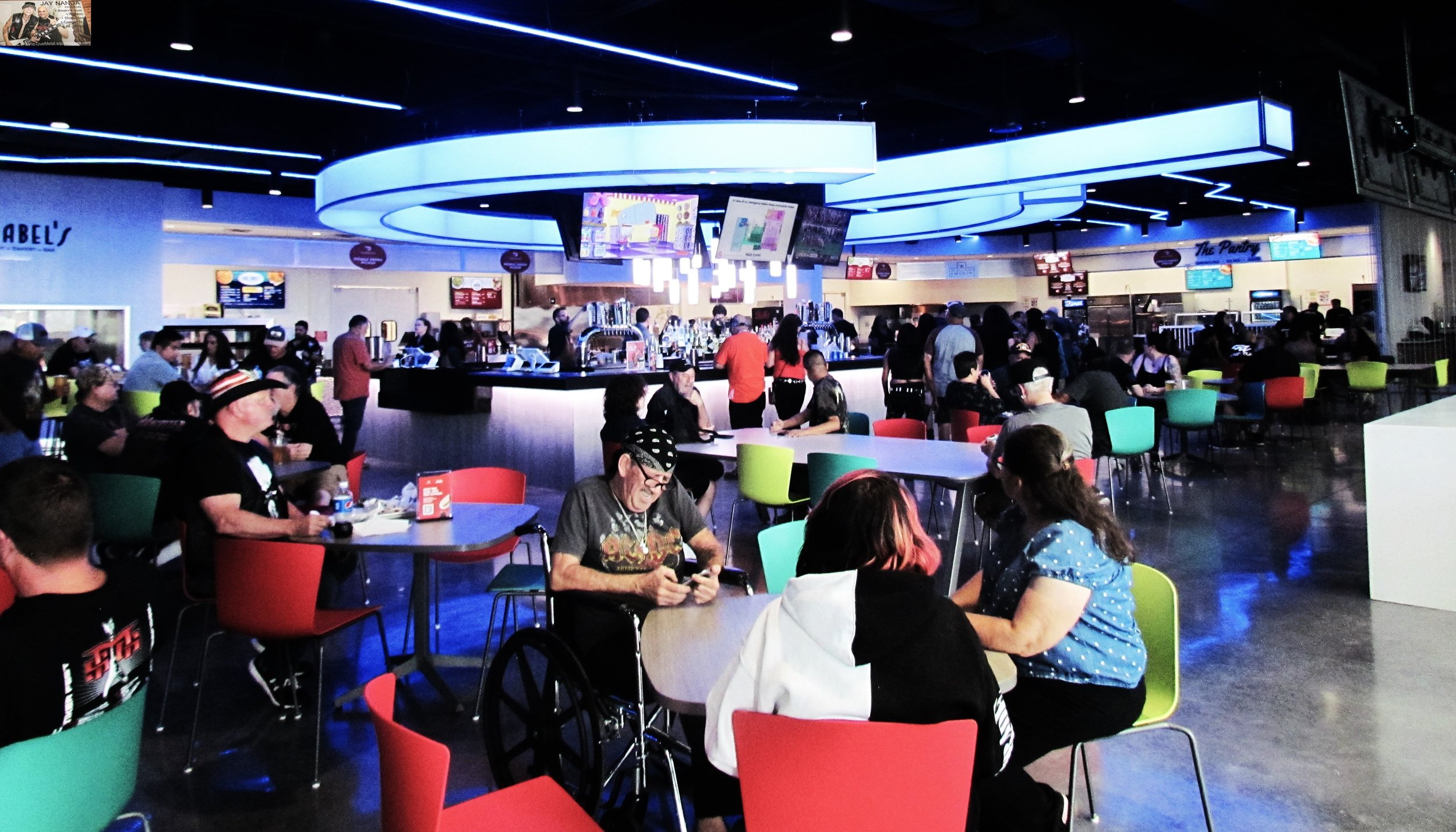  Fans partake in the brand new arena’s food center and one of its several bars. 