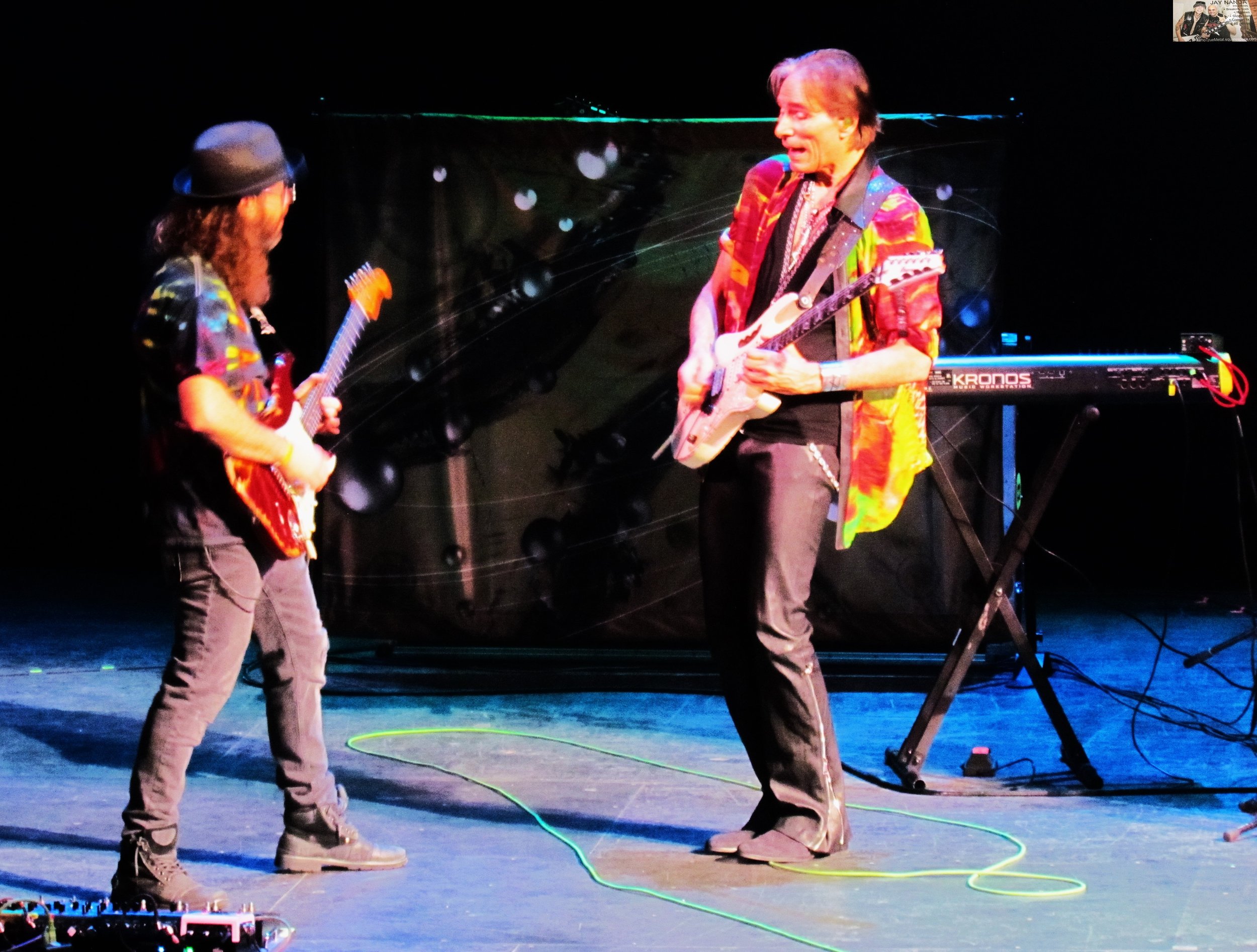  Vai and guitarist Dave Weiner (left) rock out. 