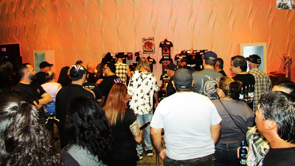  Fans converge around the merch booth. 