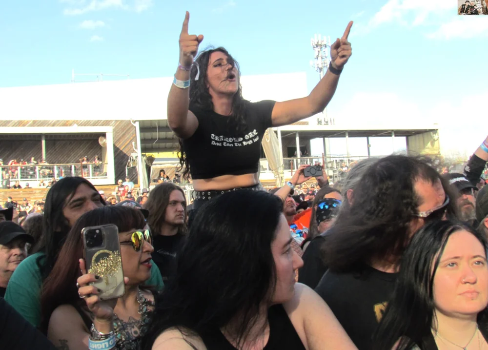  This woman had a prime seat as she sang all of the lyrics to the band’s tunes. 