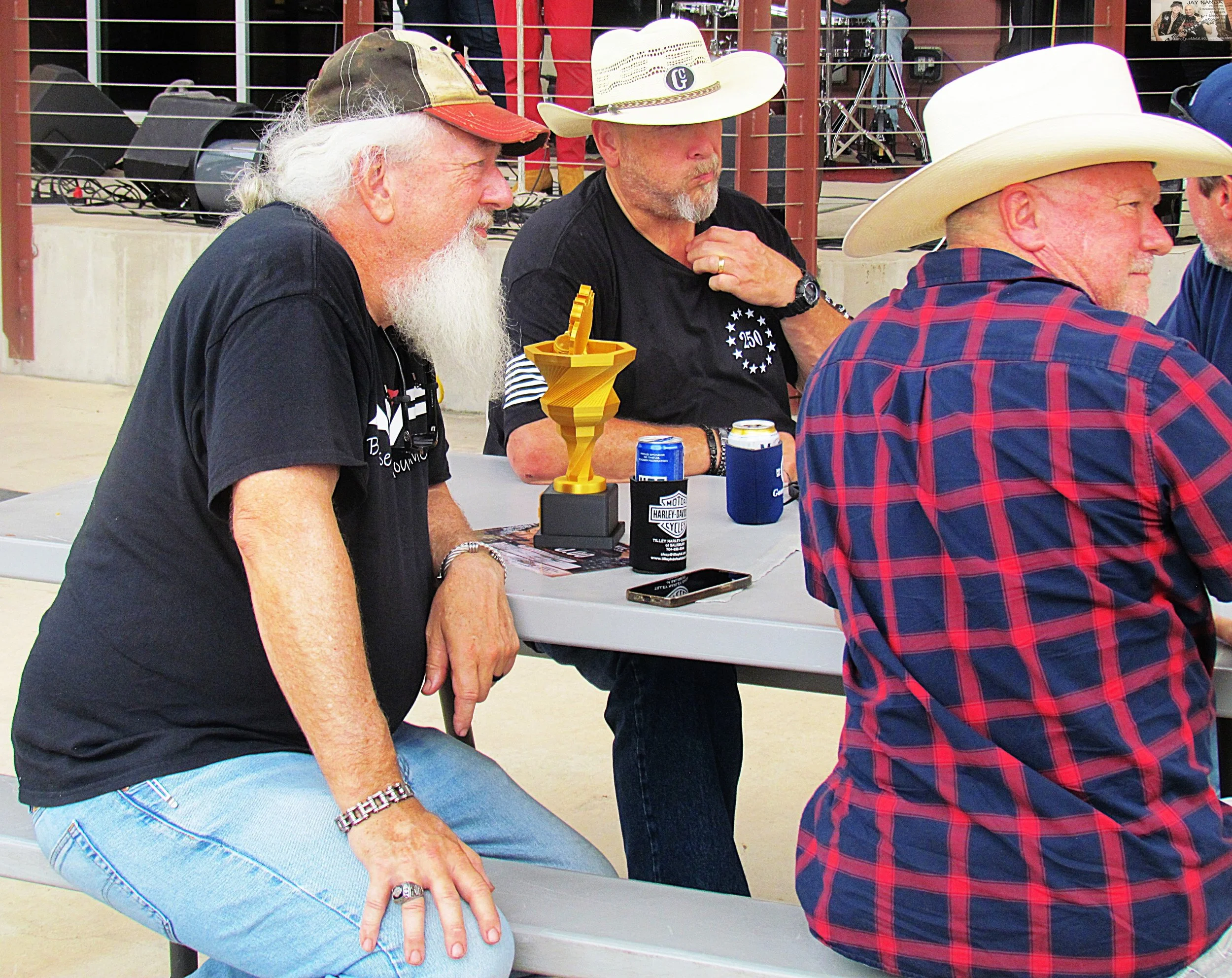  One of the contest winners (left) checks out some tunes with his friends.  