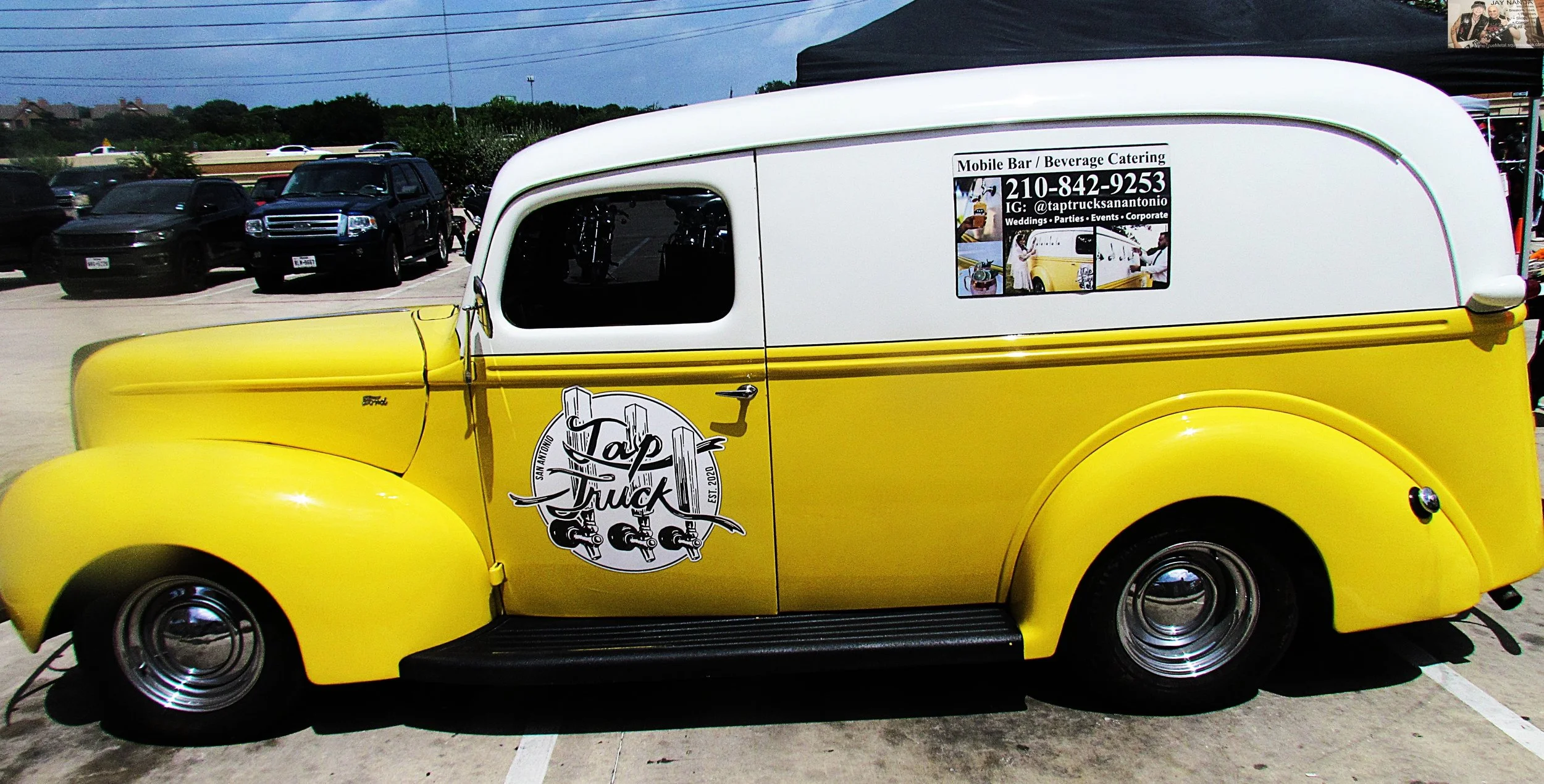  A vintage car was a product of one of the small bars outside the Harley Davidson facility. 