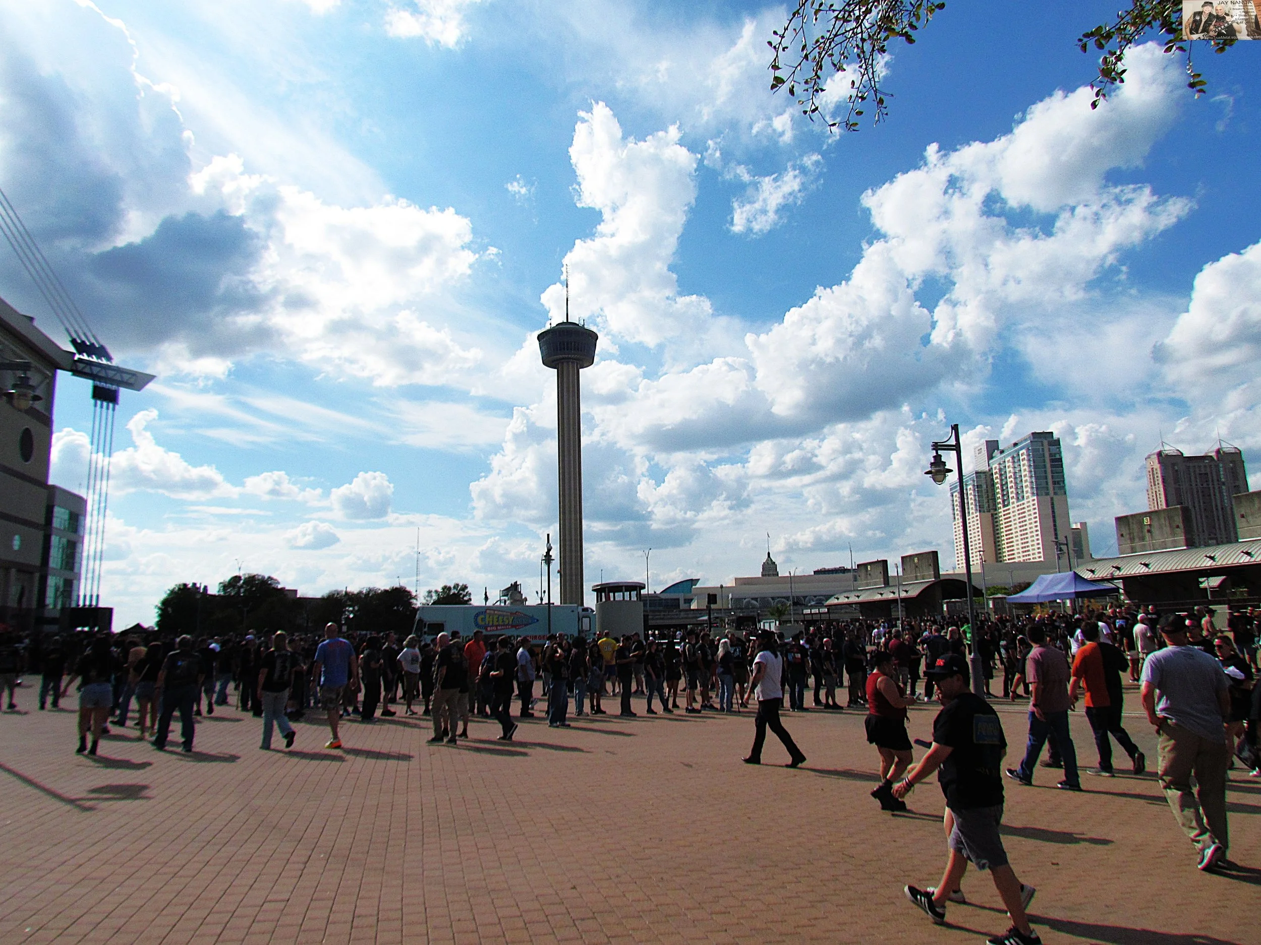  The line for merch extends toward the Tower of Americas within the Alamodome’s confines.  