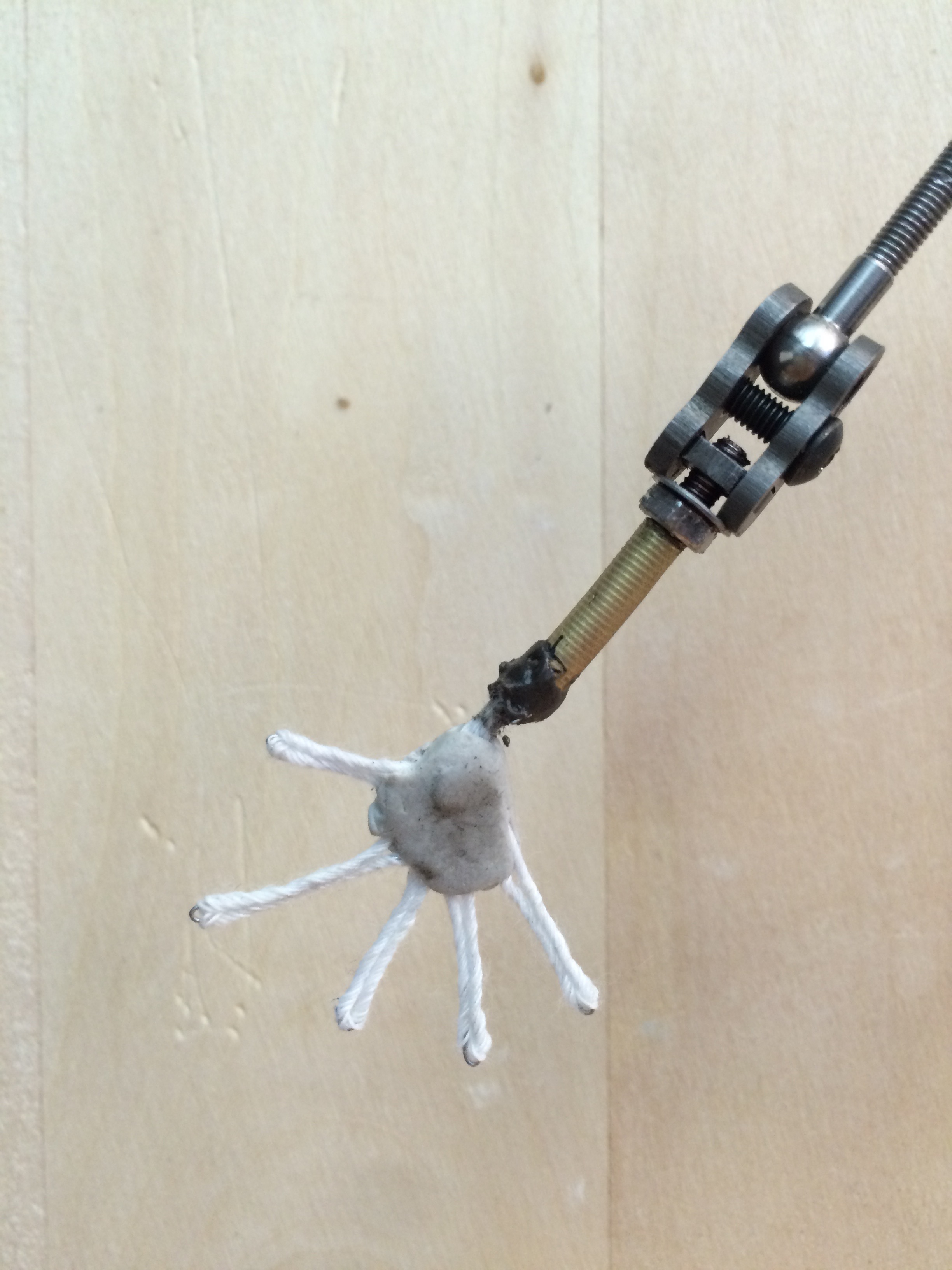 Threaded brass coupling rod to connect new hand armature wire. The hands also have miniature magnets in the palm.