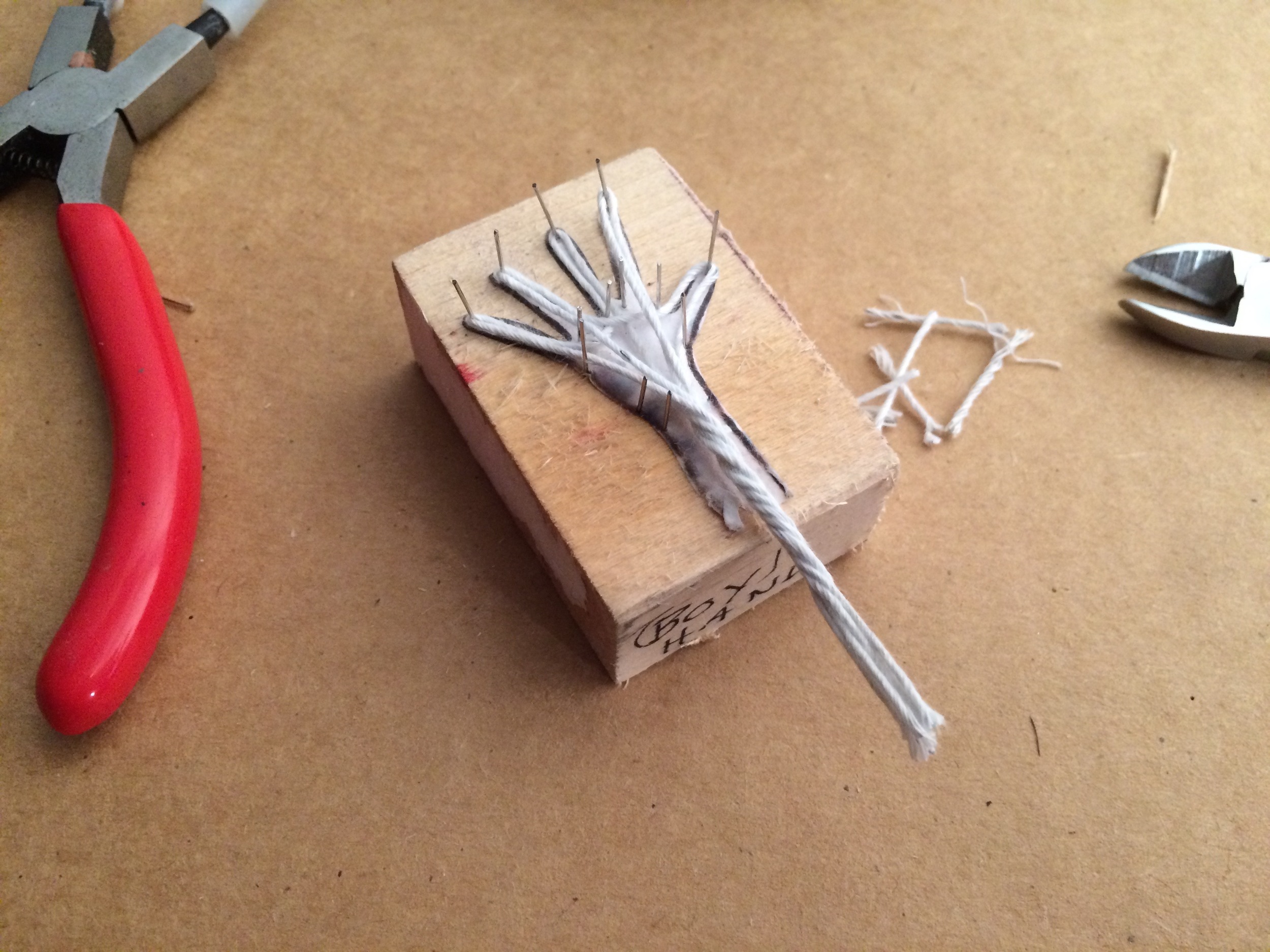 Miniature hand building is incredibly detailed work, and I've created a "jig" to help create consistent hand armatures. It's based on a tool I saw that helps jewelers to make earrings! It's been a great tool and I've made a jig for each of the characters.