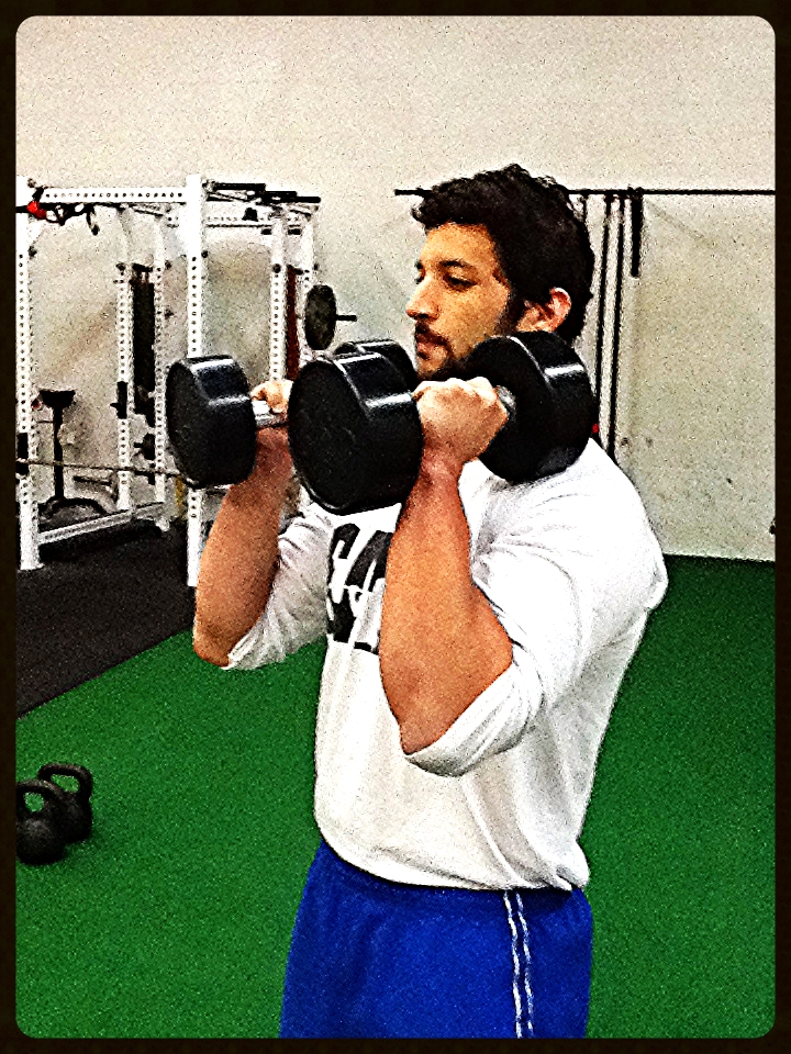  This is the proper way to hold dumbbells when performing Double Arm Racked Squats.