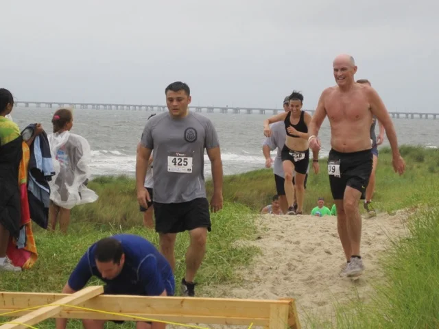 Running up the dunes. See? Choosing to have fun despite how miserable it is to run up multiple sand dunes.