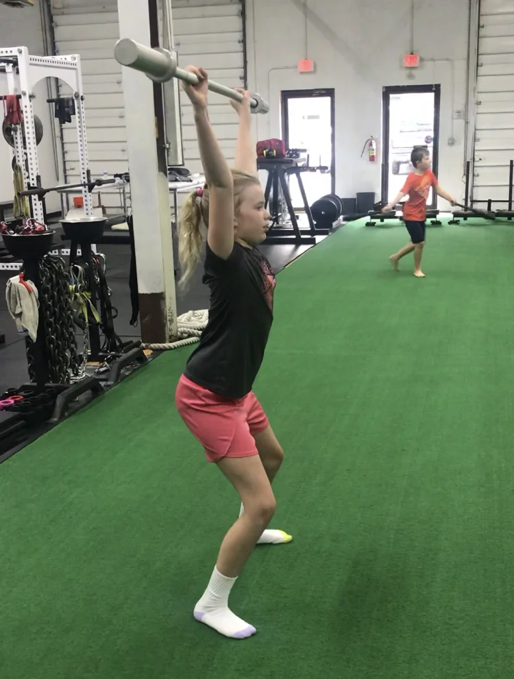 The catch position for the snatch requires overhead strength and ability to stabilize the whole body.