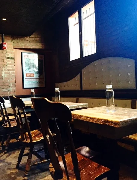 Tables at the Spotted Owl crafted from three hundred year old barn wood flooring. 