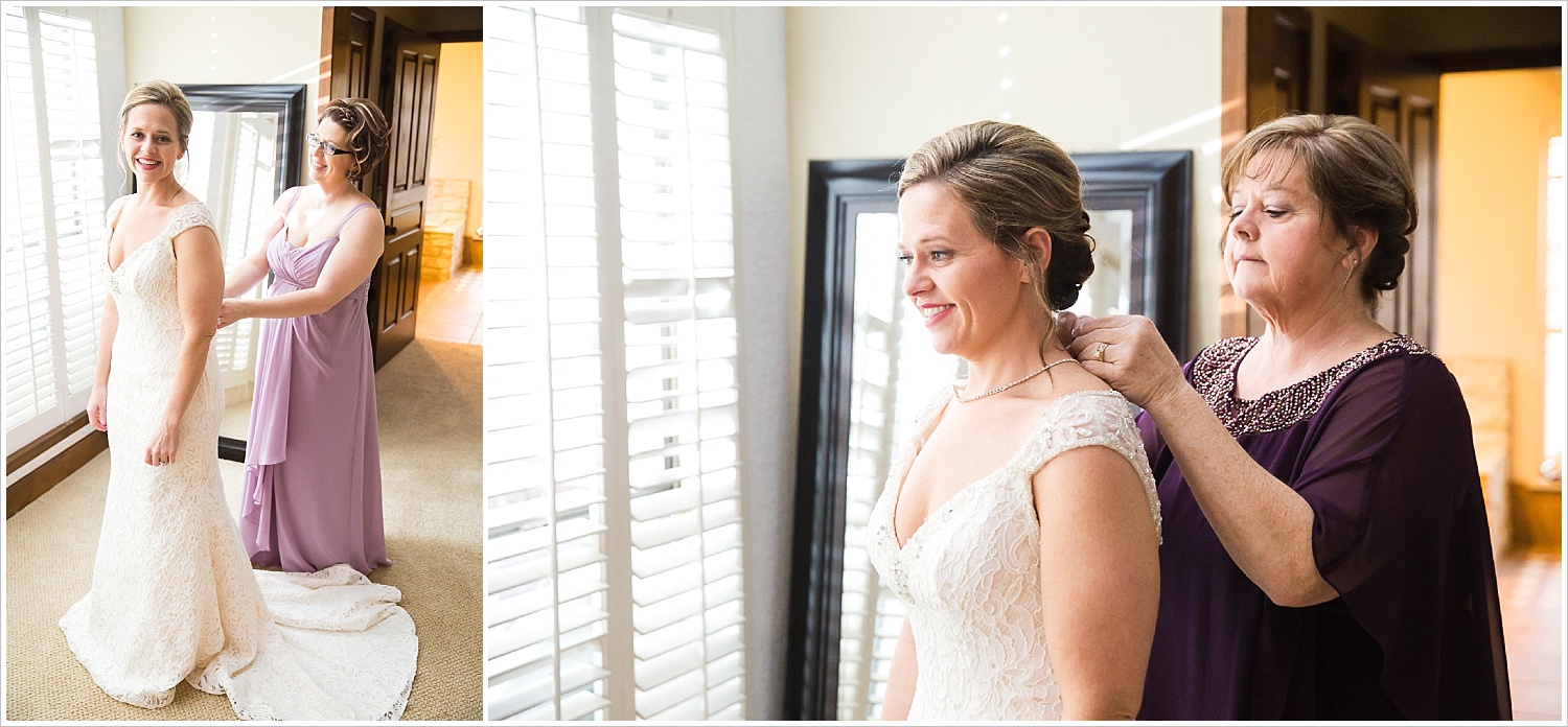 Mother of the bride and sister help bride finish getting in her wedding gown