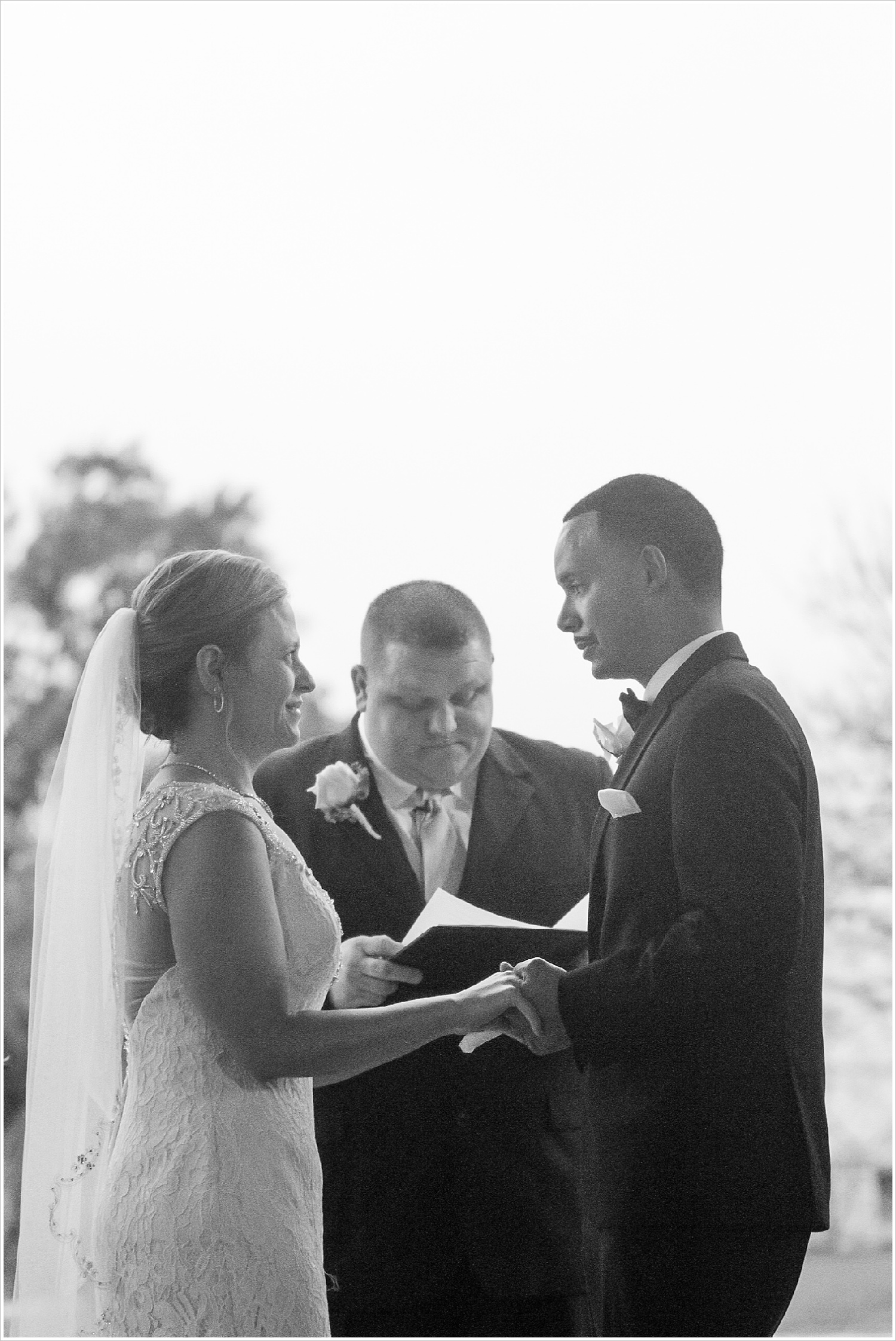 Bride and groom exchange vows at rainy wedding ceremony at La Rio Mansion