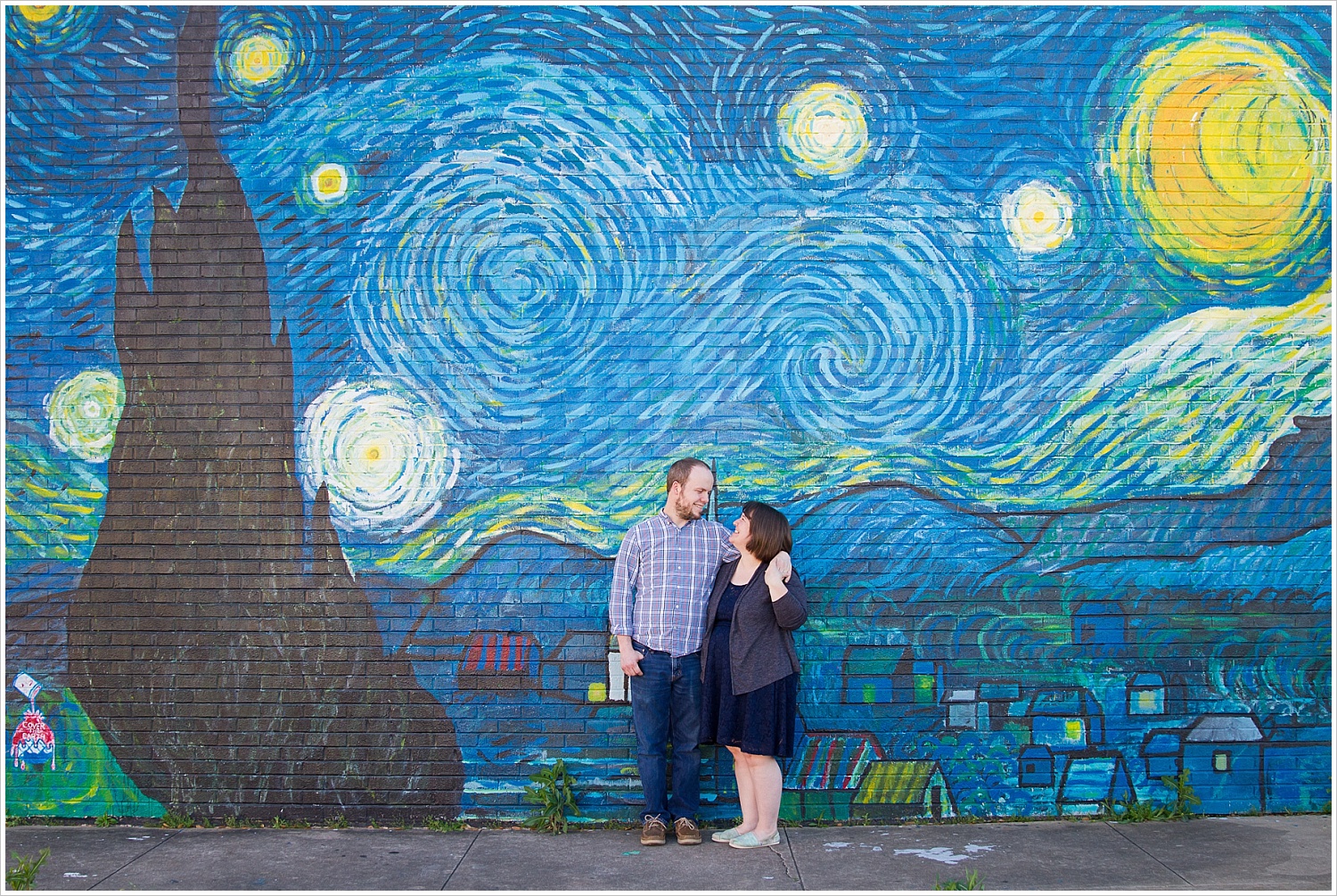 Couple poses in front of Starry Night wall mural in downtown Waco, Texas