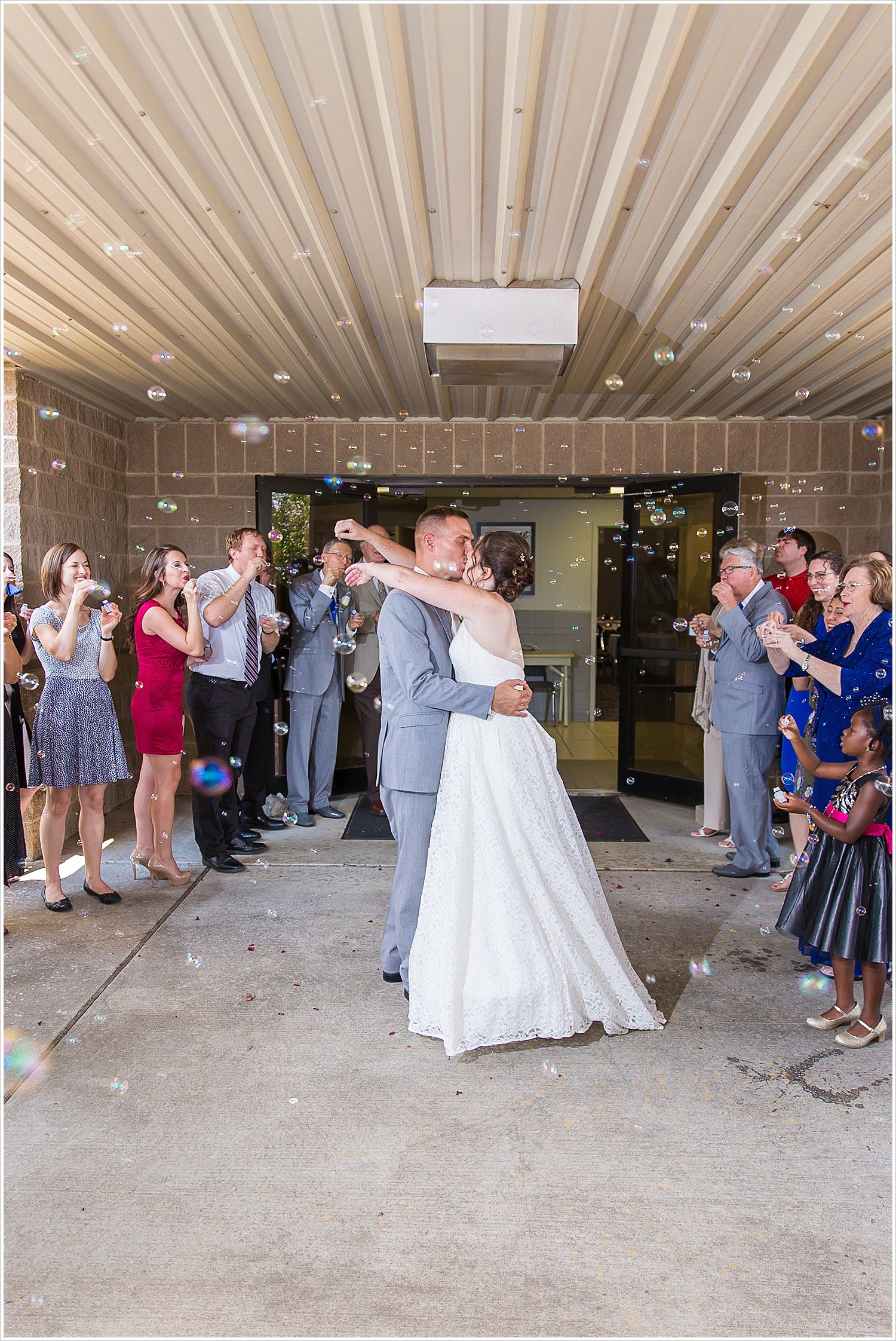Bride and groom during bubble exit at Central Presbyterian Church in Waco/Woodway, TX - Jason & Melaina Photography, www.jasonandmelaina.com