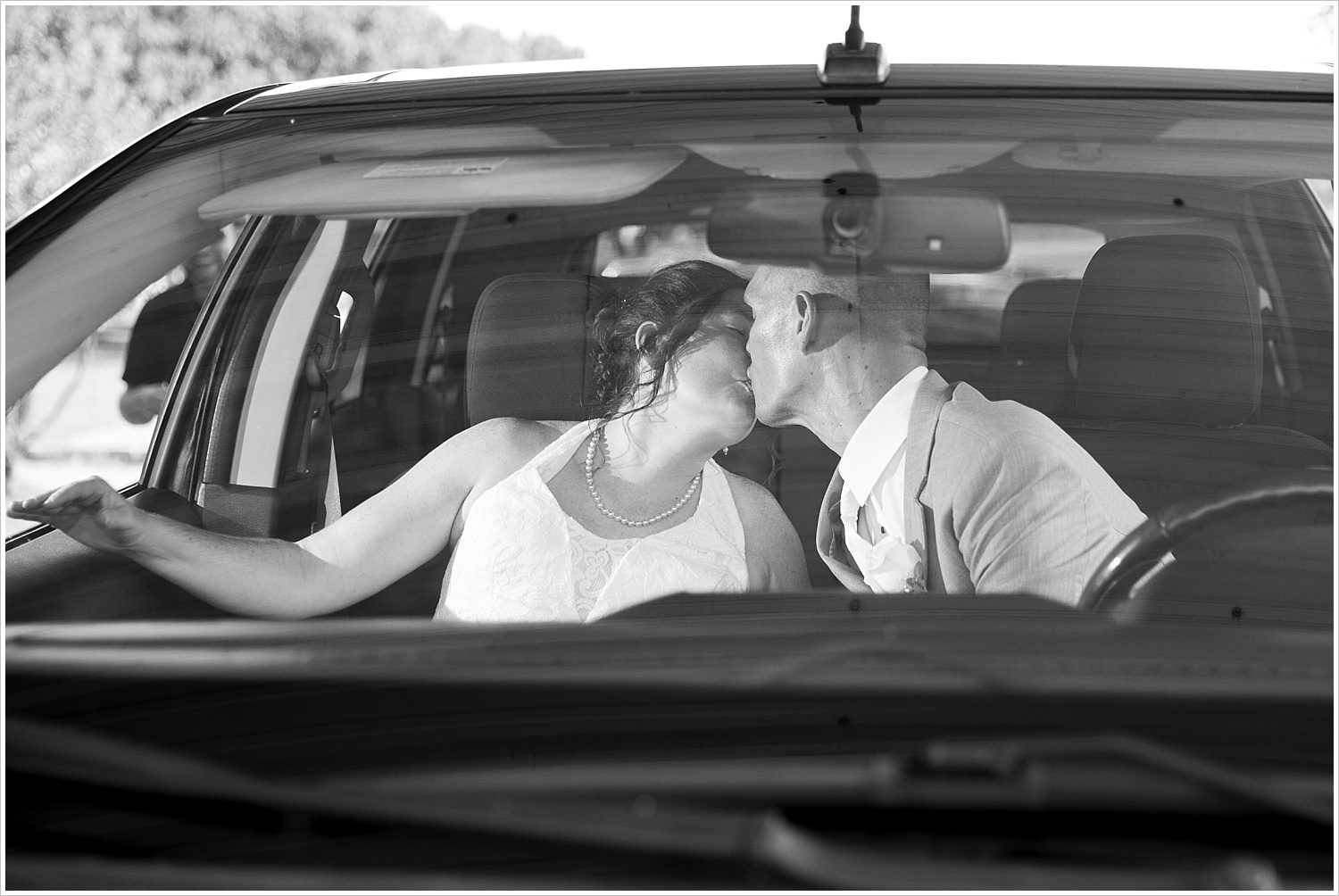 Bride and groom kiss as they leave their wedding reception at Central Presbyterian Church in Waco/Woodway, TX - Jason & Melaina Photography, www.jasonandmelaina.com