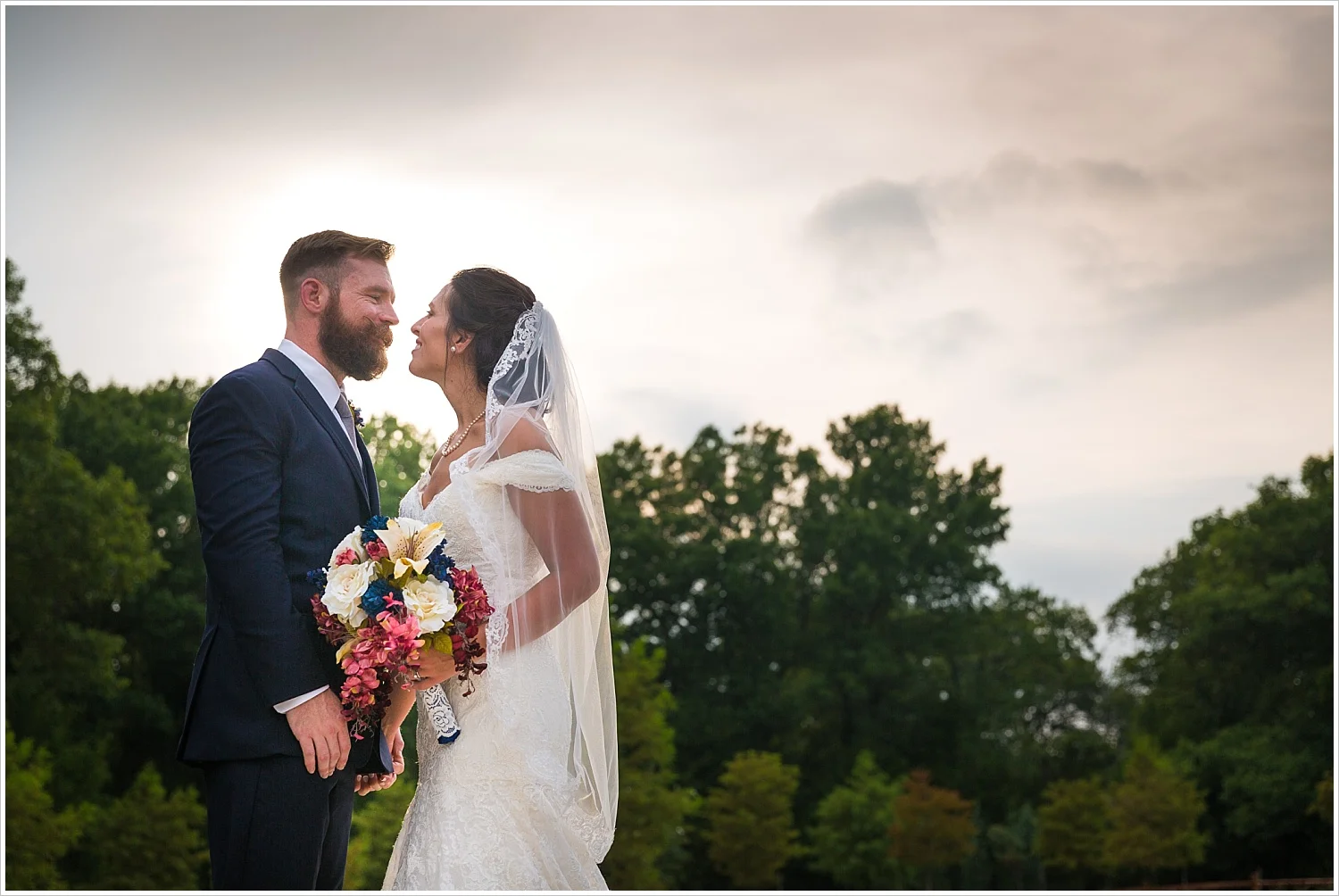 Groom & Bride with cloudy sky behind them, summer blush and navy wedding at Stone Hall at The Springs in McKinney, Texas, Jason & Melaina Photography, www.jasonandmelaina.com
