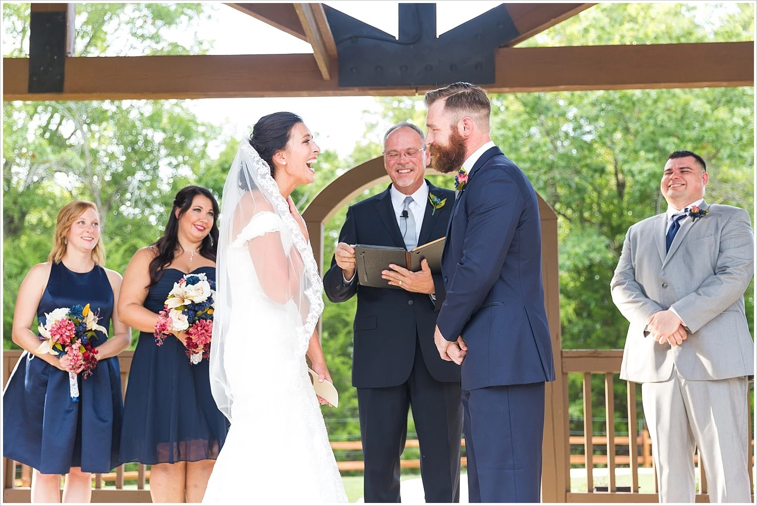 Bride reacts to groom's vows, summer blush and navy wedding at Stone Hall at The Springs in McKinney, Texas, Jason & Melaina Photography, www.jasonandmelaina.com