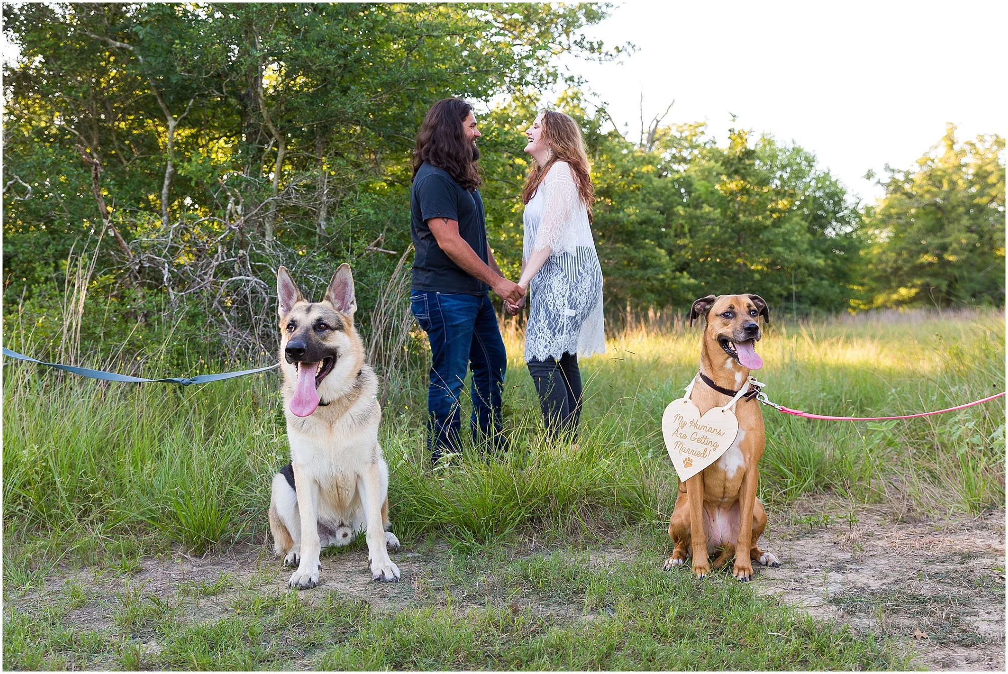 Couple pose with their two dogs for engagement photos in College Station, Texas - Jason & Melaina Photography - www.jasonandmelaina.com