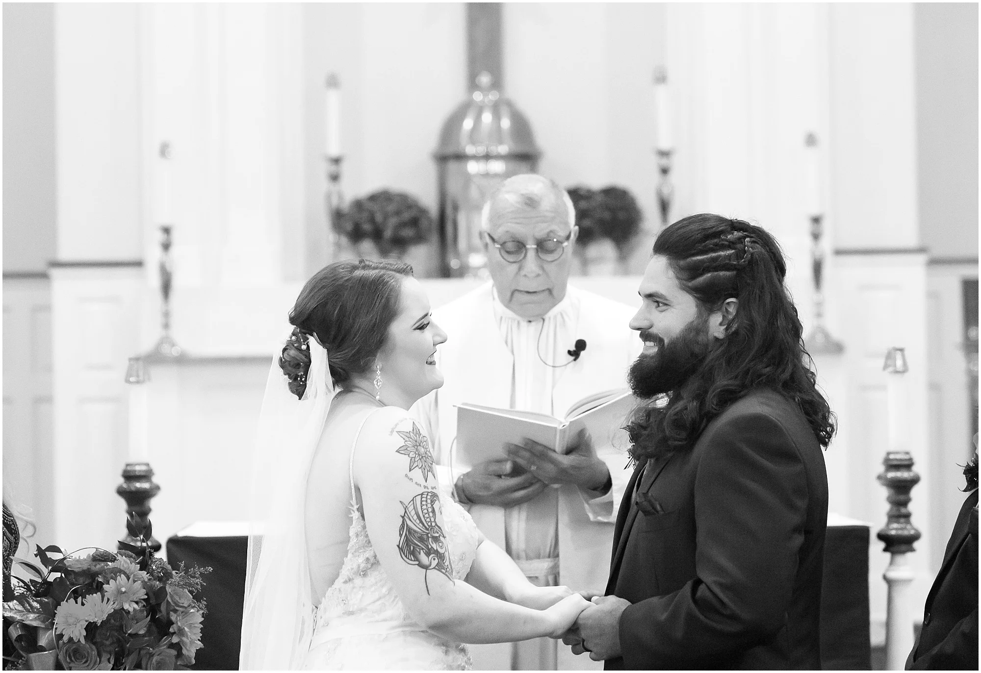 Groom and bride smile at one another after exchanging vows, black and white image - Jason & Melaina Photography - http://jasonandmelaina.com