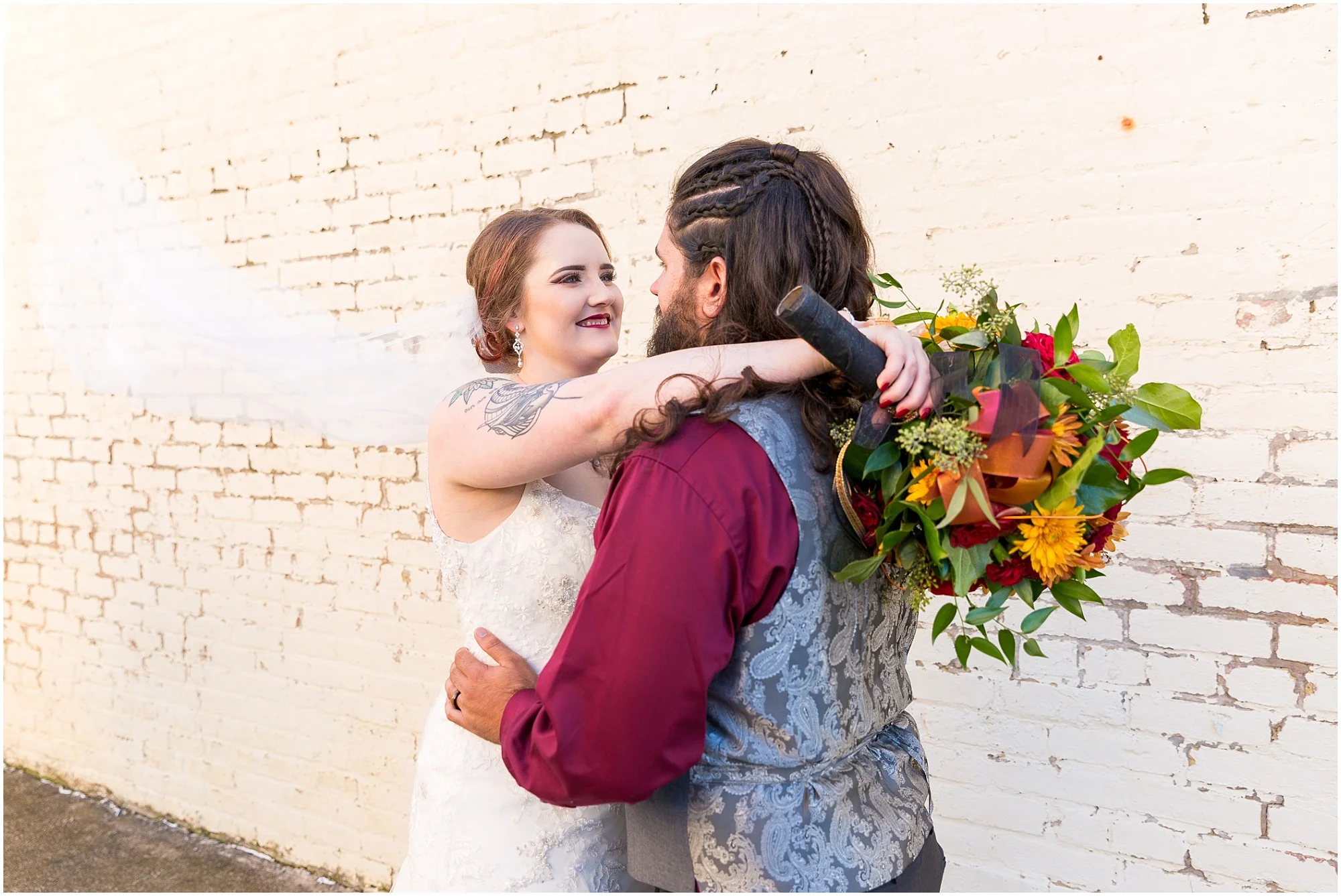 Bride smiles at groom outside wedding reception - Jason & Melaina Photography - http://jasonandmelaina.com