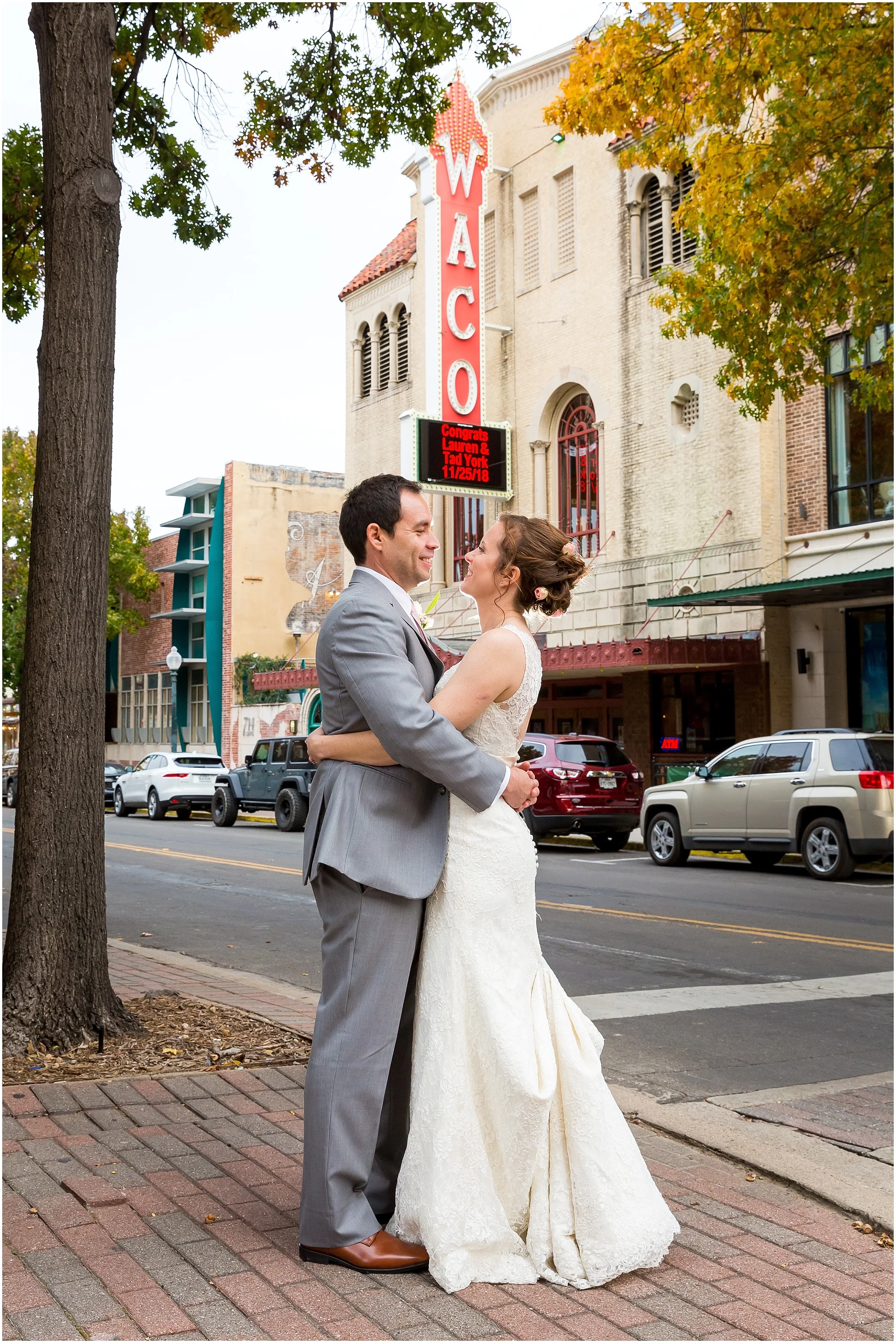 Bride and groom with their names on the Hippodrome Marquee in Waco, Texas - Jason & Melaina Photography - www.jasonandmelaina.com
