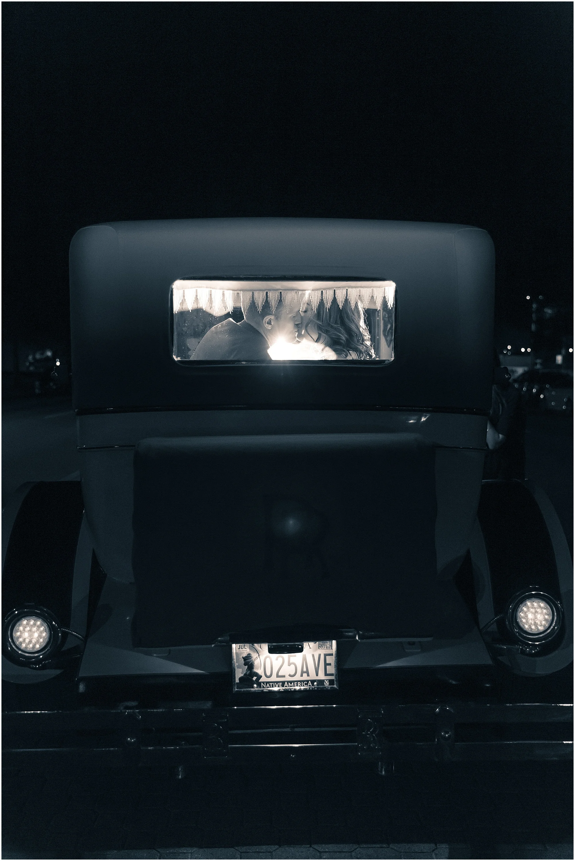 Bride & Groom kiss in the back of their Rolls Royce getaway car after their wedding at The Hippodrome, Waco, Texas - Jason & Melaina Photography - www.jasonandmelaina.com