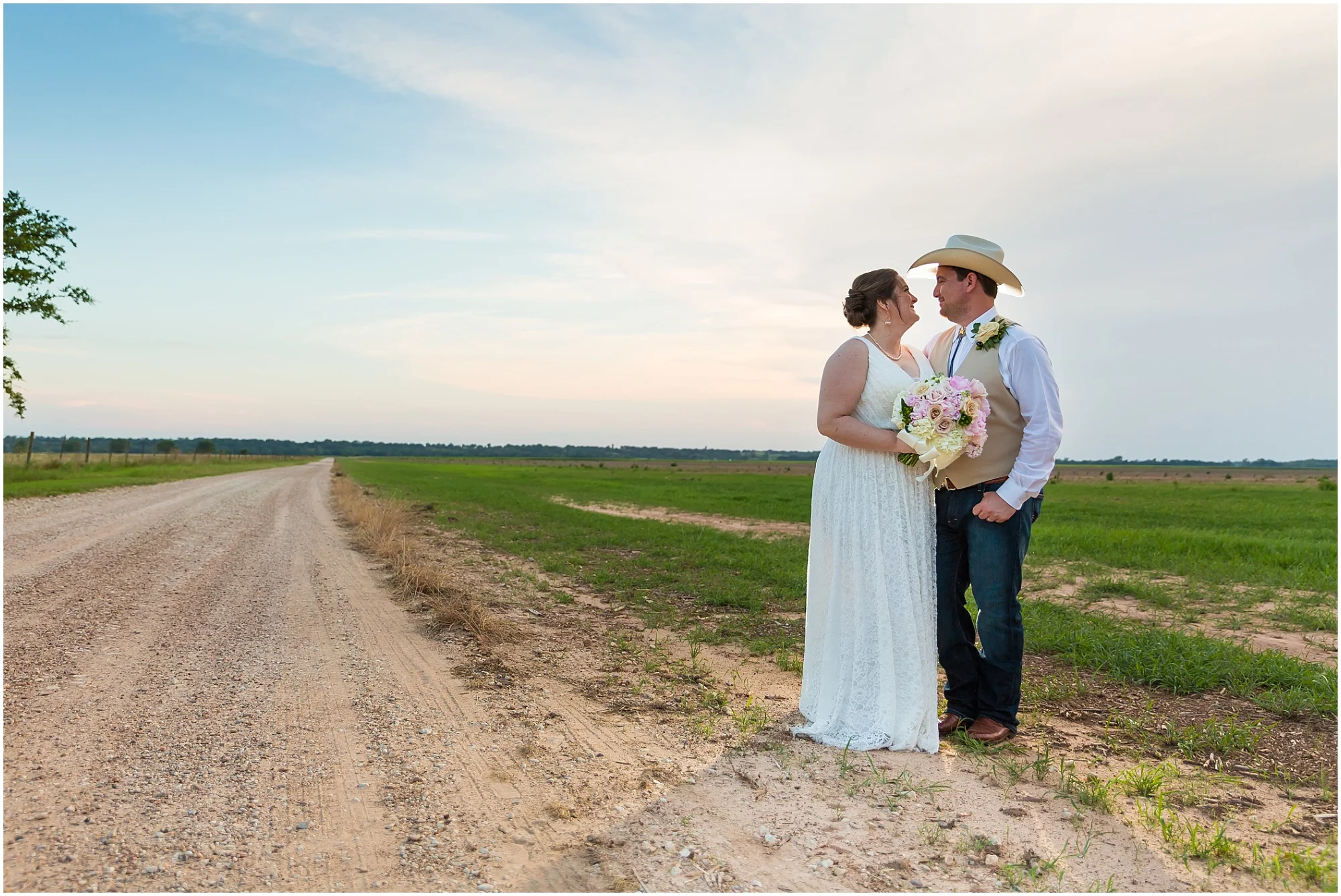 A cowboy and his bride look into one another’s eyes outside of Moon River Ranch on their wedding day | Jason & Melaina Photography | www.jasonandmelaina.com