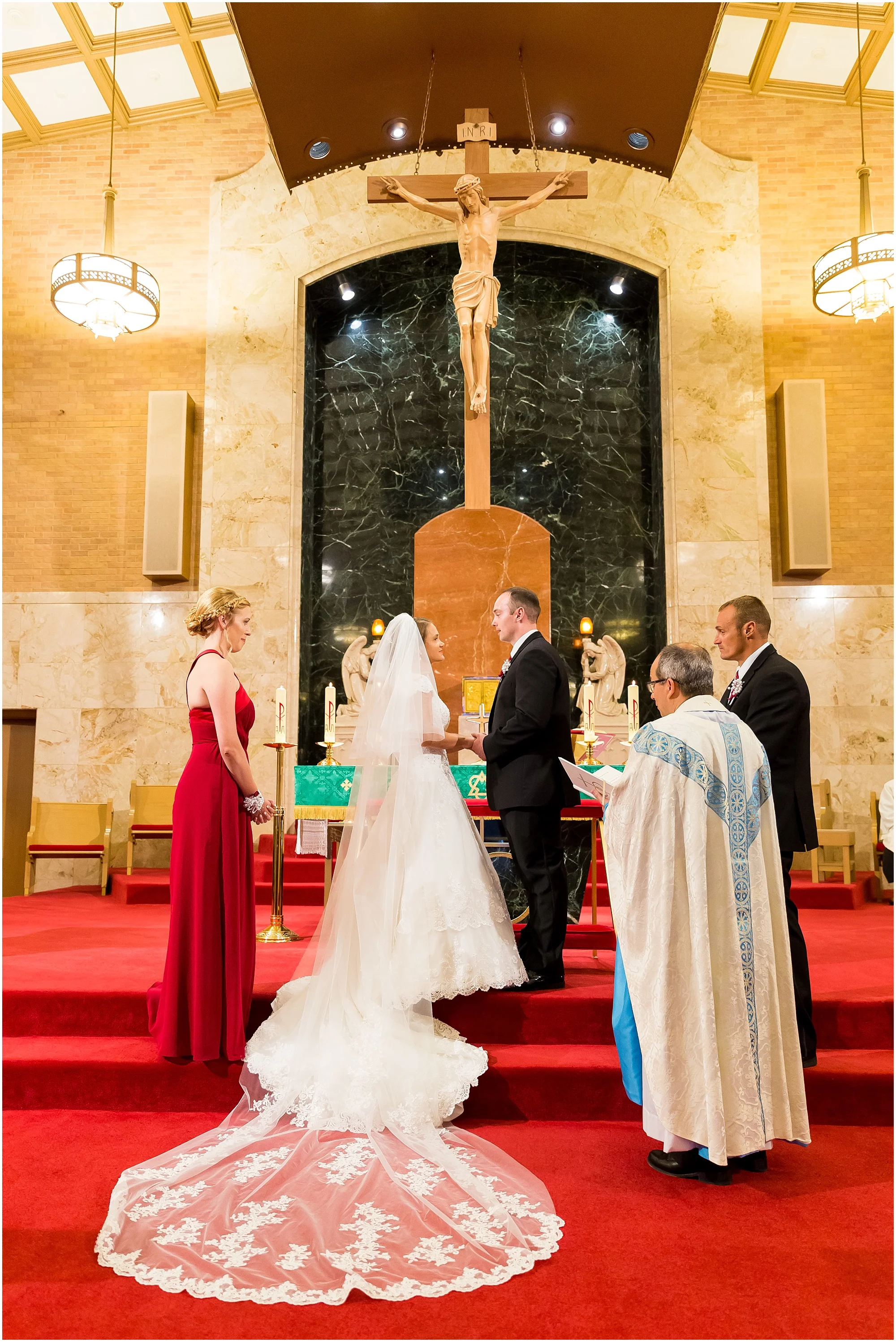 A couple exchanges vows inside St. Louis Catholic Church in Waco, Texas - Jason & Melaina Photography - www.jasonandmelaina.com
