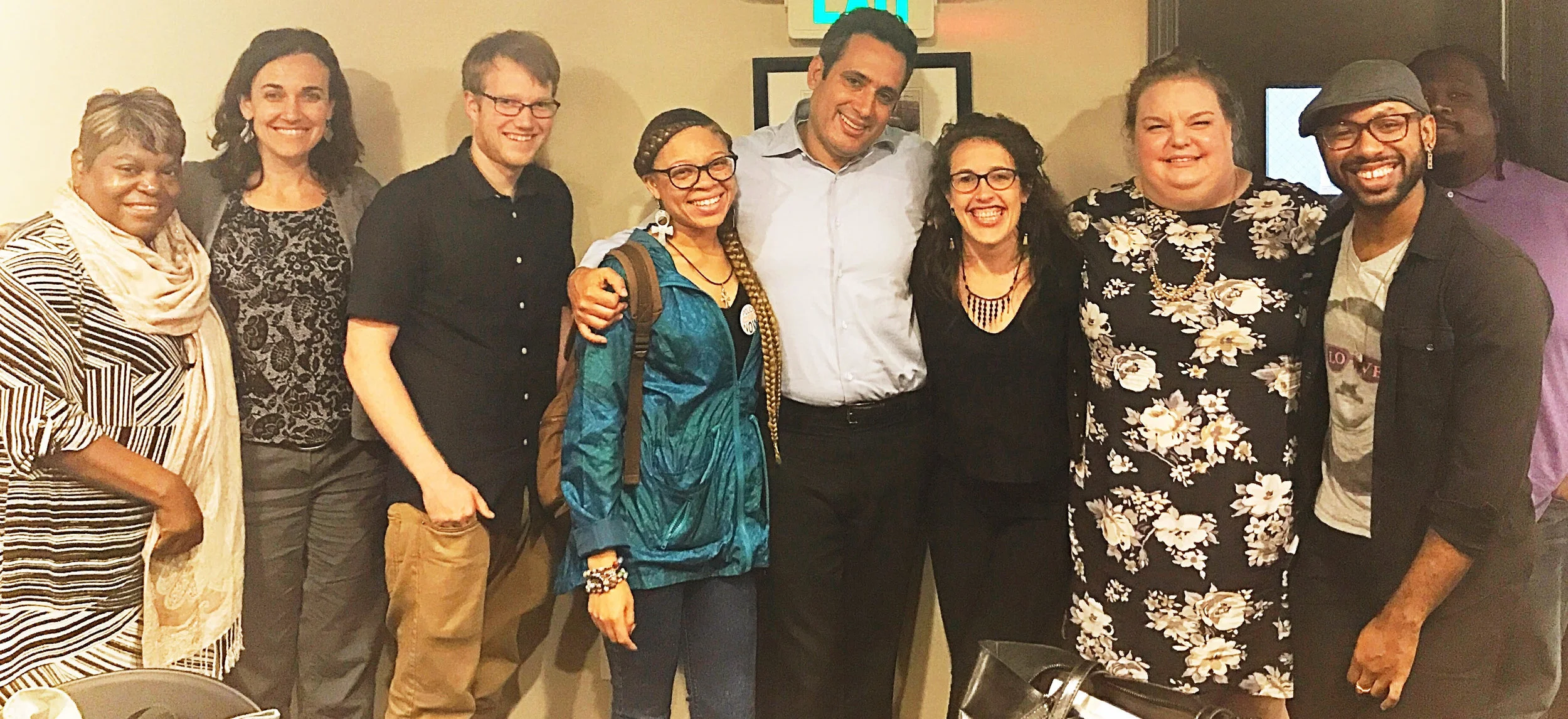 Partners from St. Ambrose Housing Aide, Youth Empowered Society!, Star Track, the Mayor's Office of Social Services, and Point Source Youth convene at St. Ambrose Housing Aide