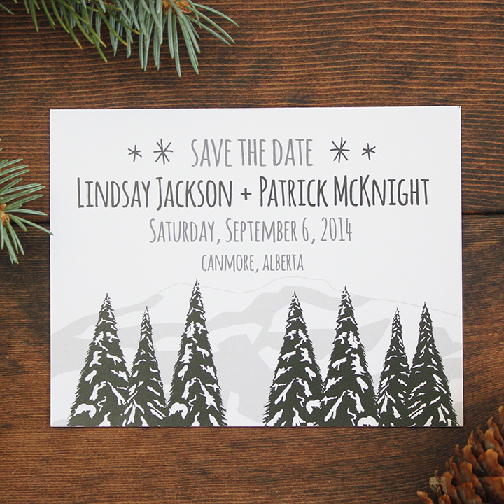 Winter trees and mountains wedding save the date invite.