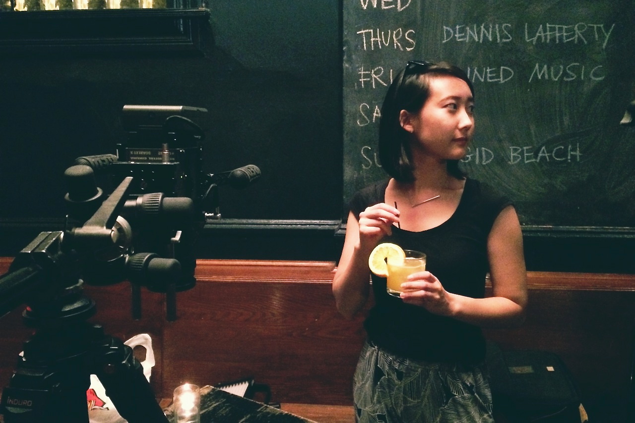 The director casually drinking away the prop.... Featured location: The Charleston.