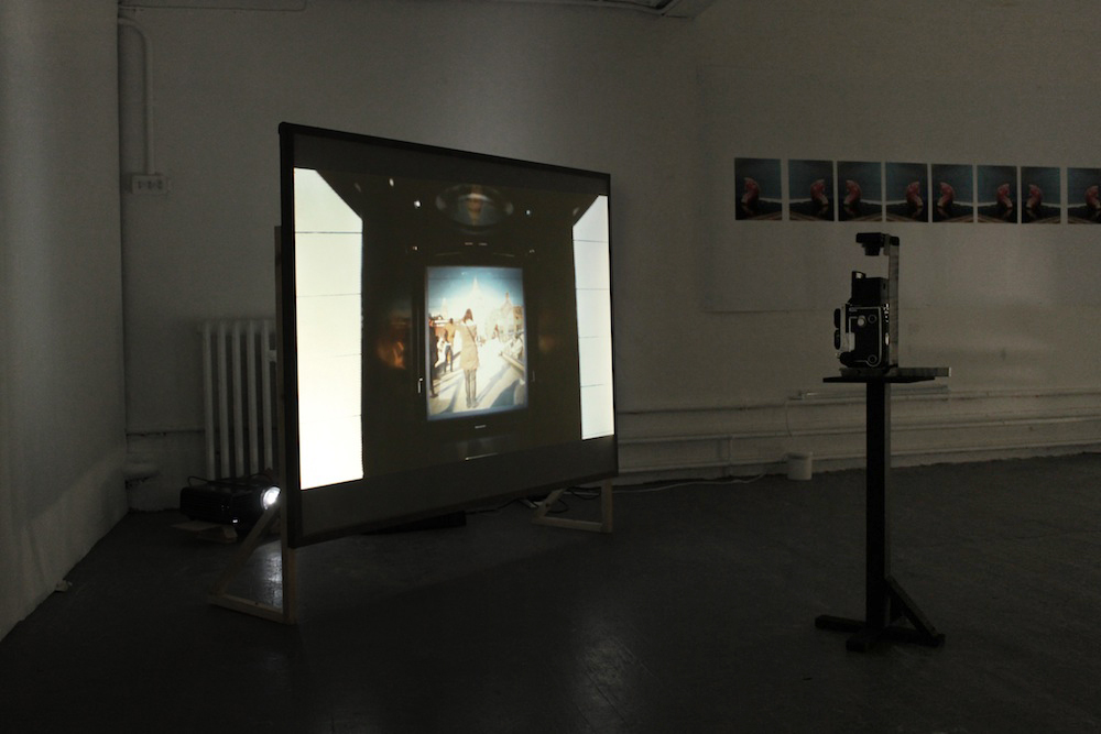 Wide view. Video rear-projected, facing the camera that captured the content.