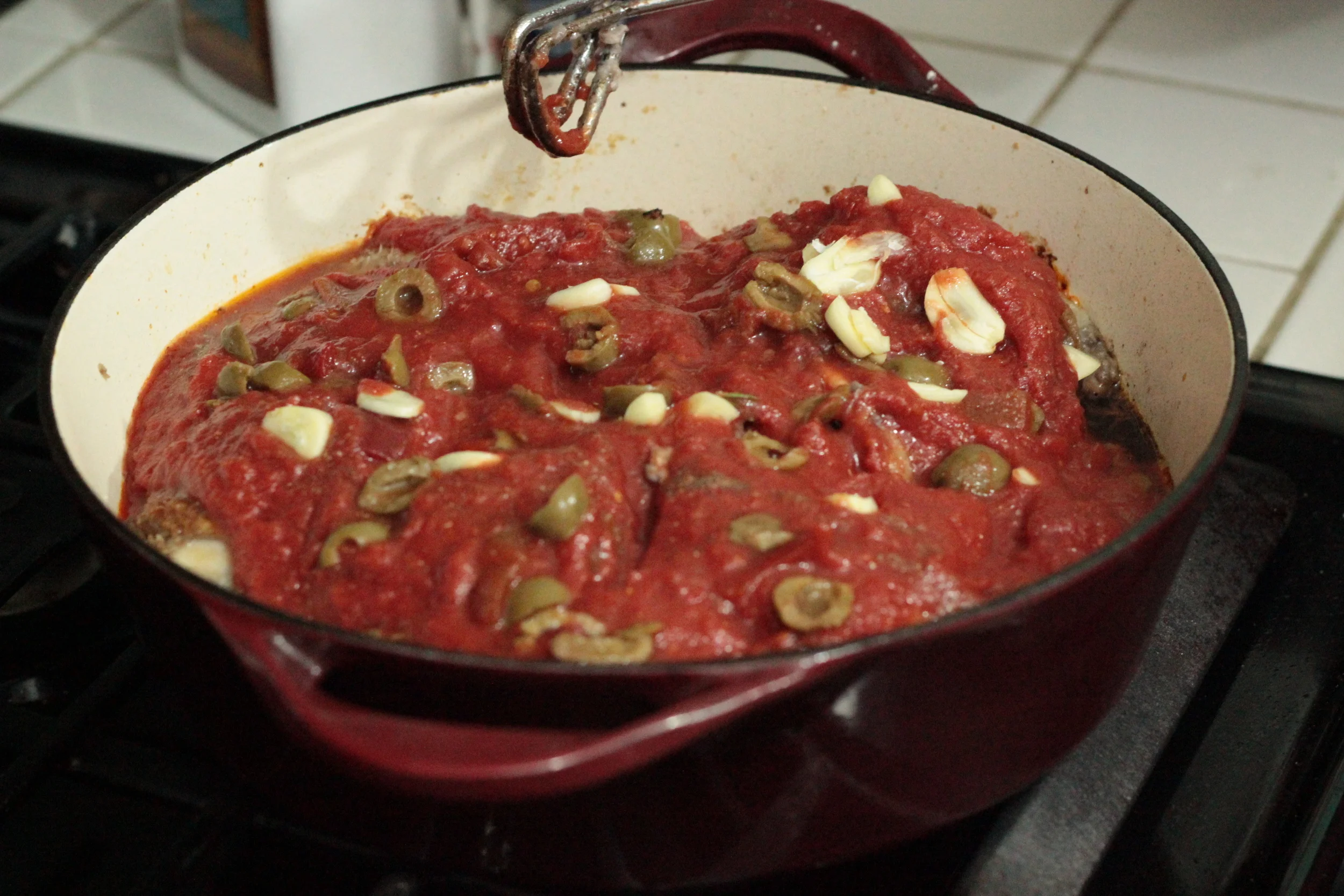 Chicken Cacciatore - add chicken, sauce, garlic, olives