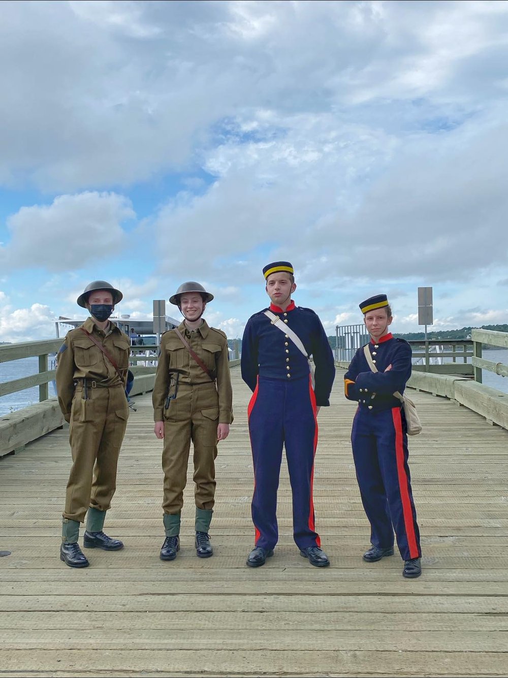  Guides in period military costumes from World War 2 and the 1800s. 