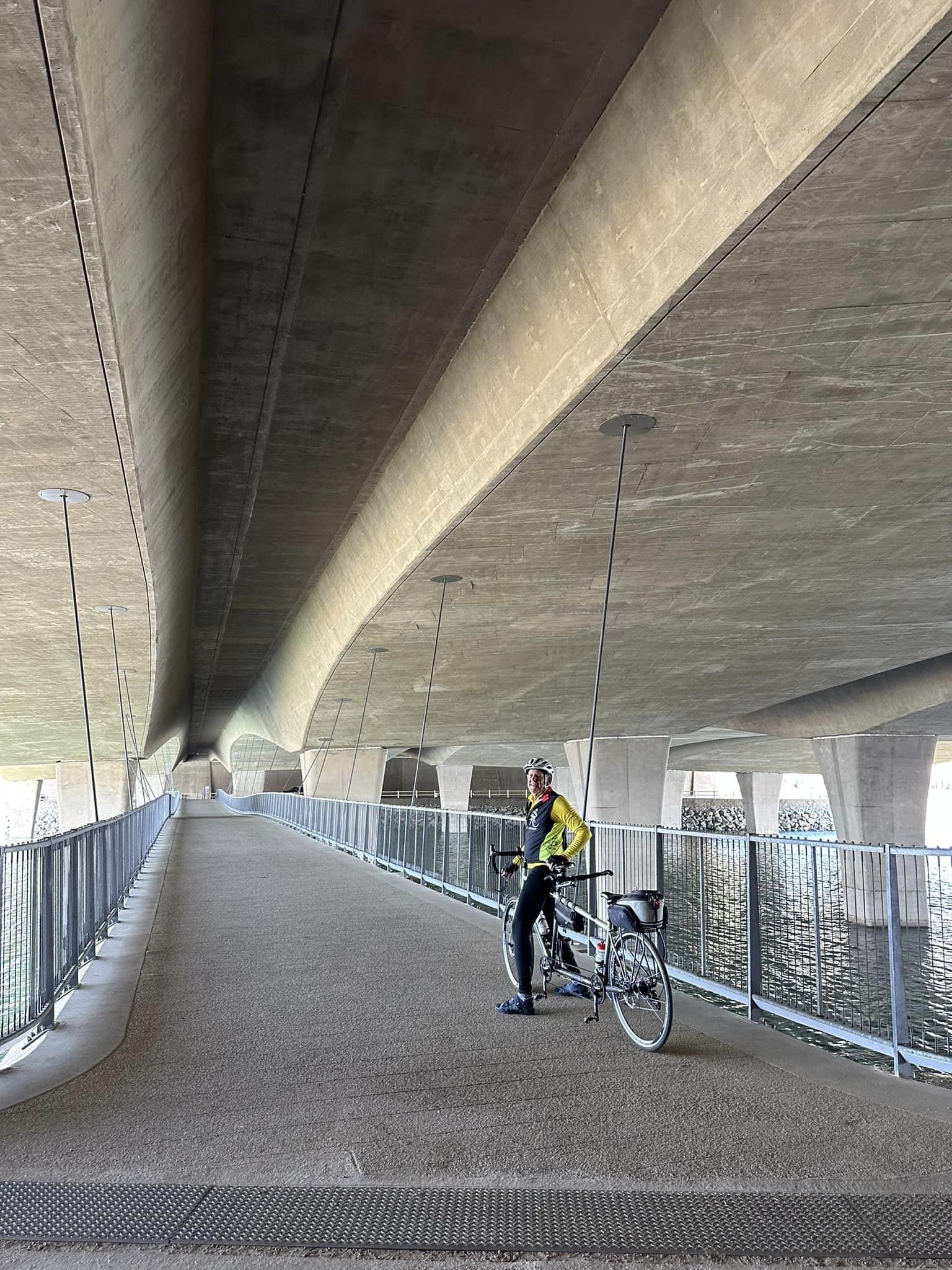  Pedestrian and cycling bridge under the car bridge. 