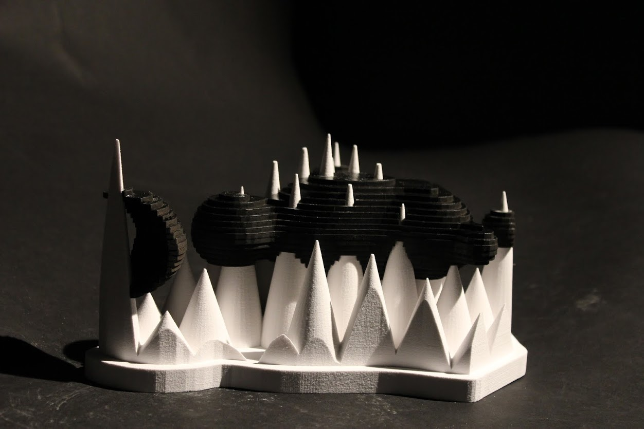  View of ink blots floating on spiked 'mountain range'. 