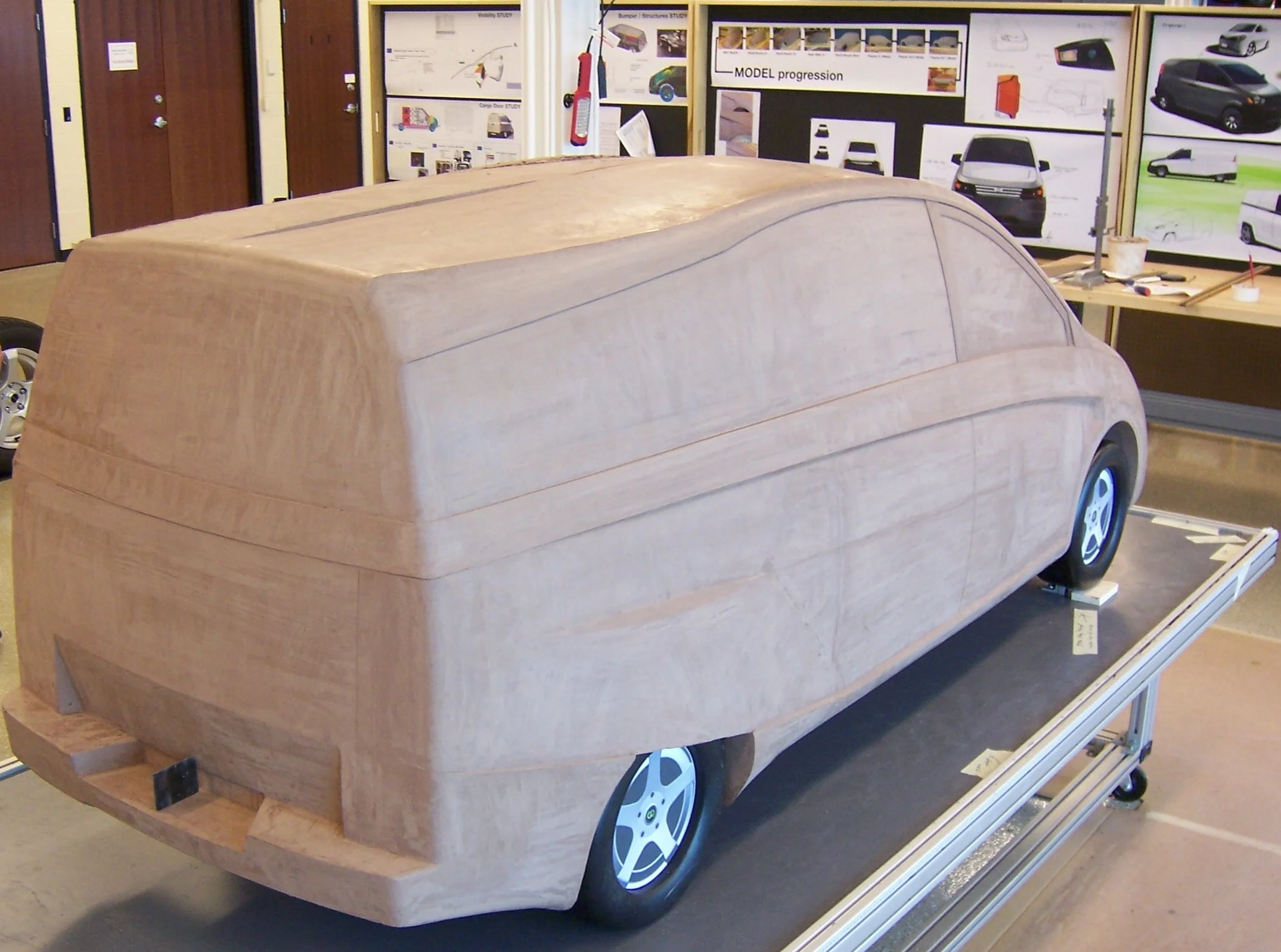  The 1/2 scale clay model was completed and 3D scanned for constructing the exterior body panels to mate to the frame/powertrain CAD models. This entire exterior design was delivered in 12 weeks from concept to clay model by our small team of four. 