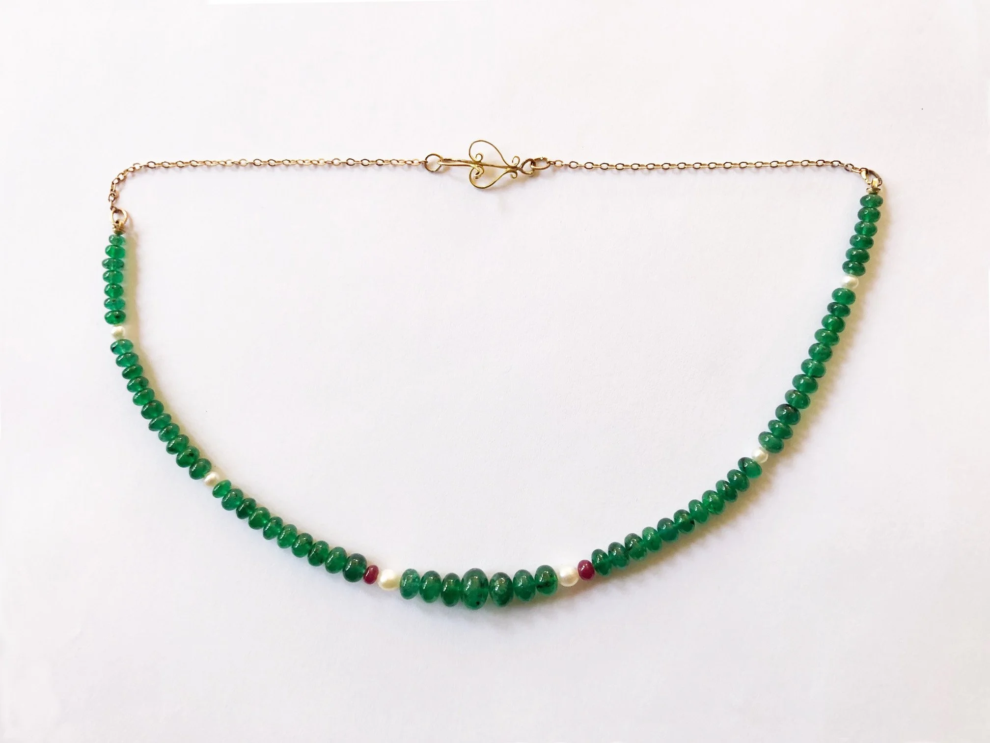 Emerald necklace. Gold, emerald, ruby, pearl. Length: 35.5 cm. $350