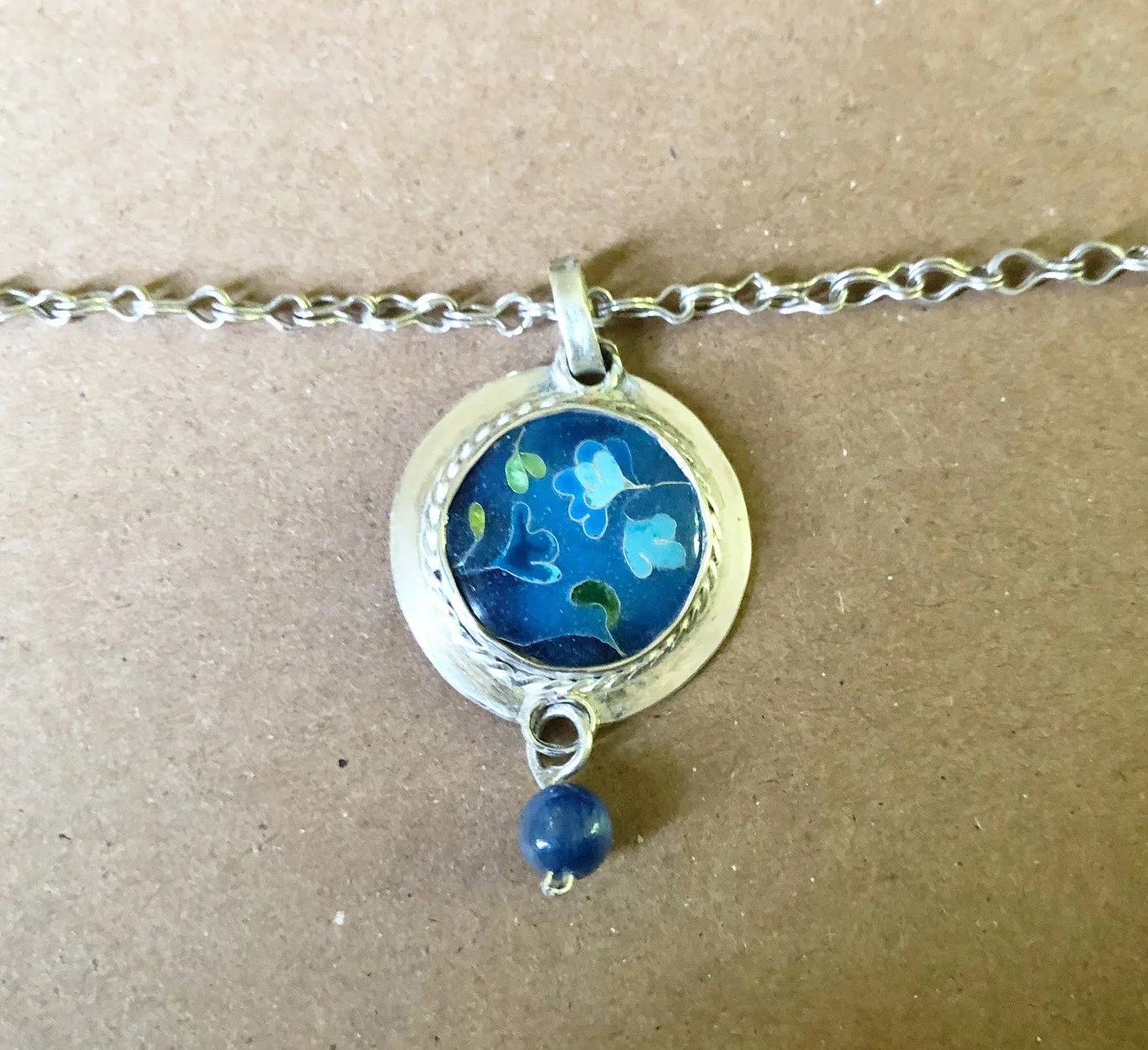 Blue floral, pendant. Silver, floral, kyanite. 4.5 x 2.5 cm. $750