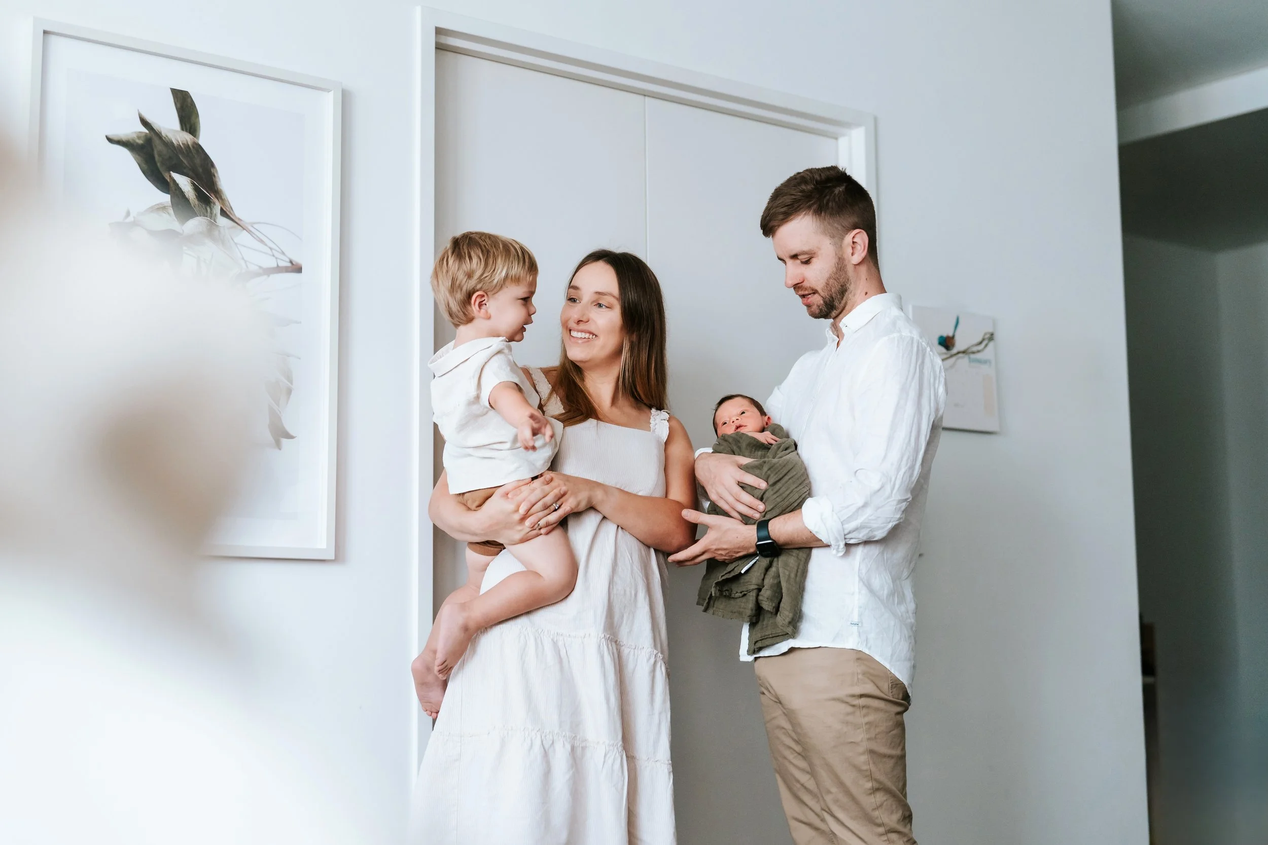 Family holding a newborn baby