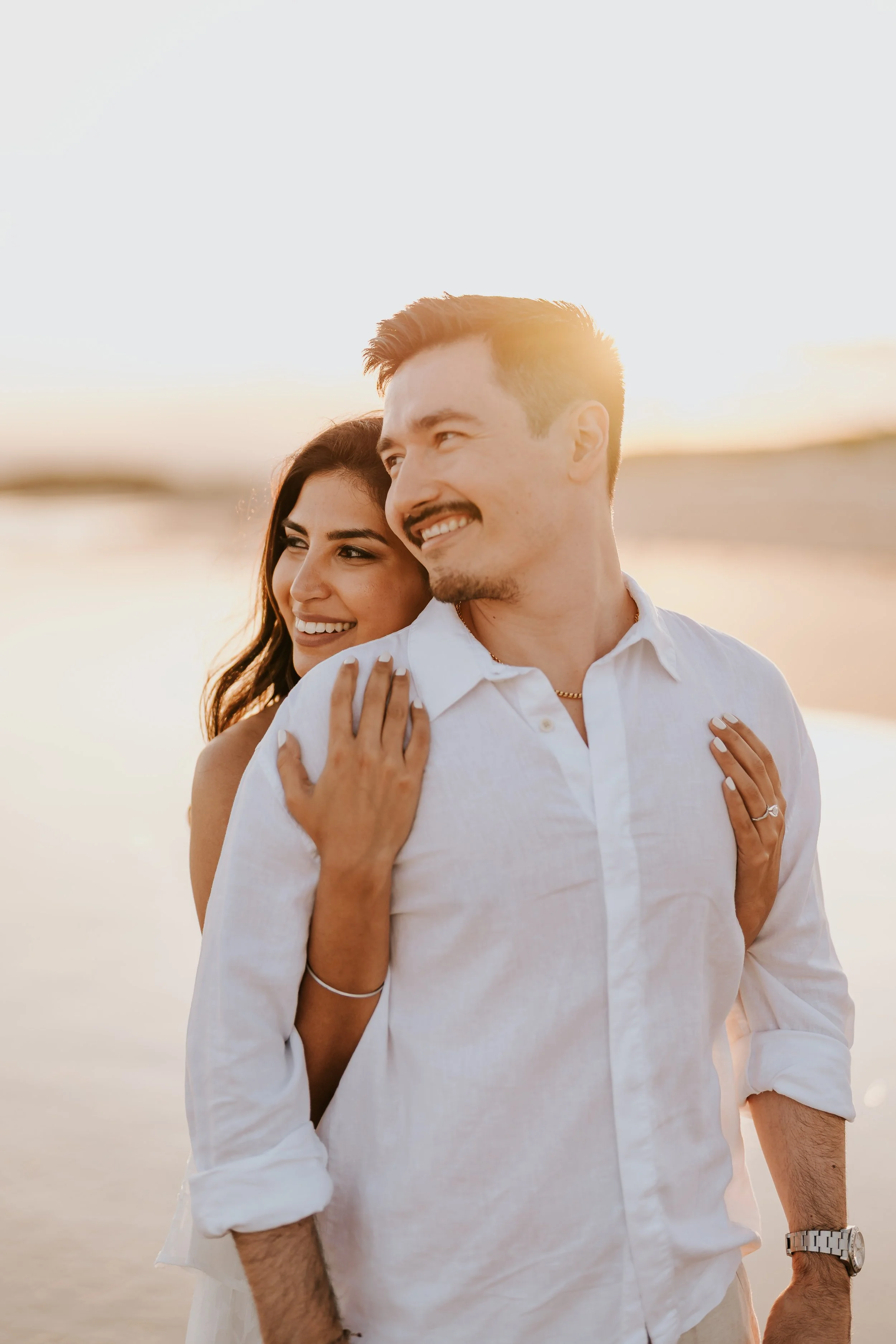 Bride & Groom Hugging at Sunset on Beach