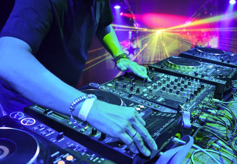 DJ mixing in a Nightclub - 833 x 575.jpg