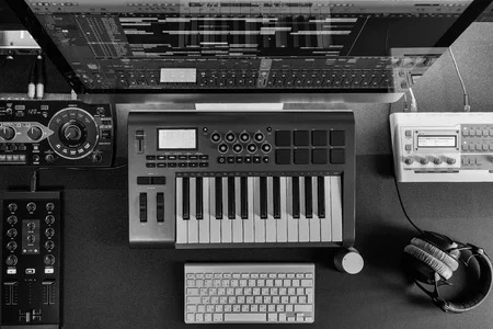 Home music studio producer 450 Height x 300 Width.jpg