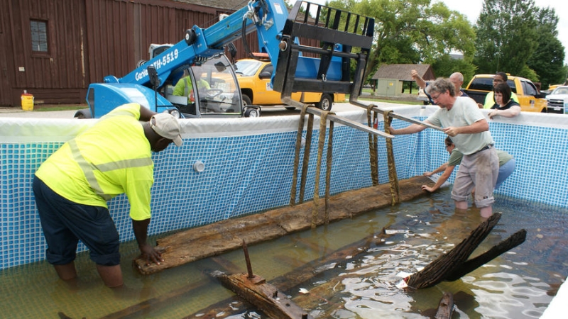 Timbers are immediately re-submerged in water for preservation purposes (Photo courtesy of Maryland State Highway Administration)