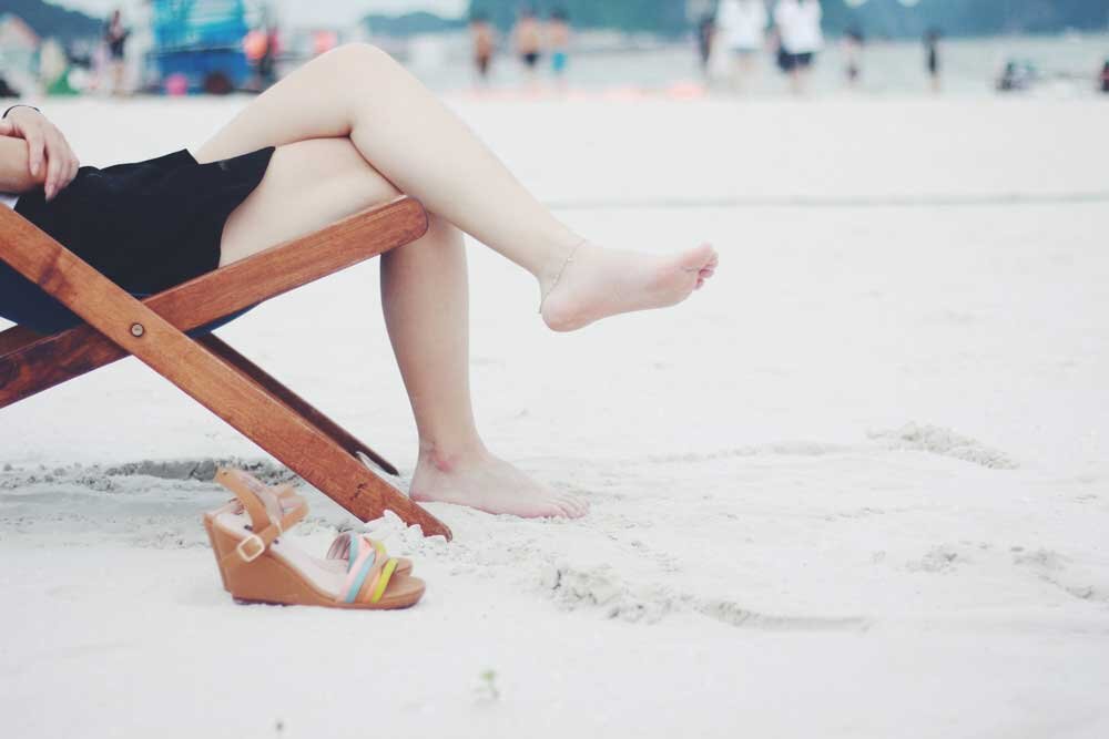 Person sat on deckchair on beach.jpg