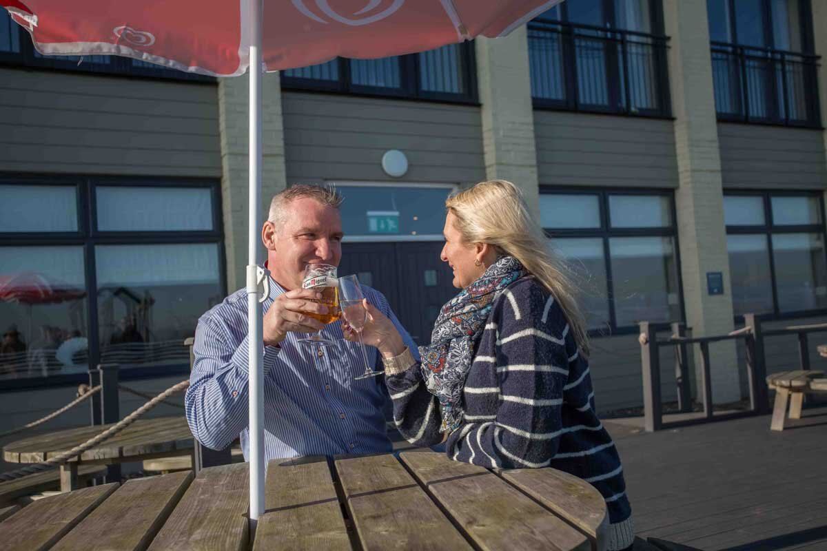 Couple enjoying a drink outside at Waterside Park and Hotel.jpg